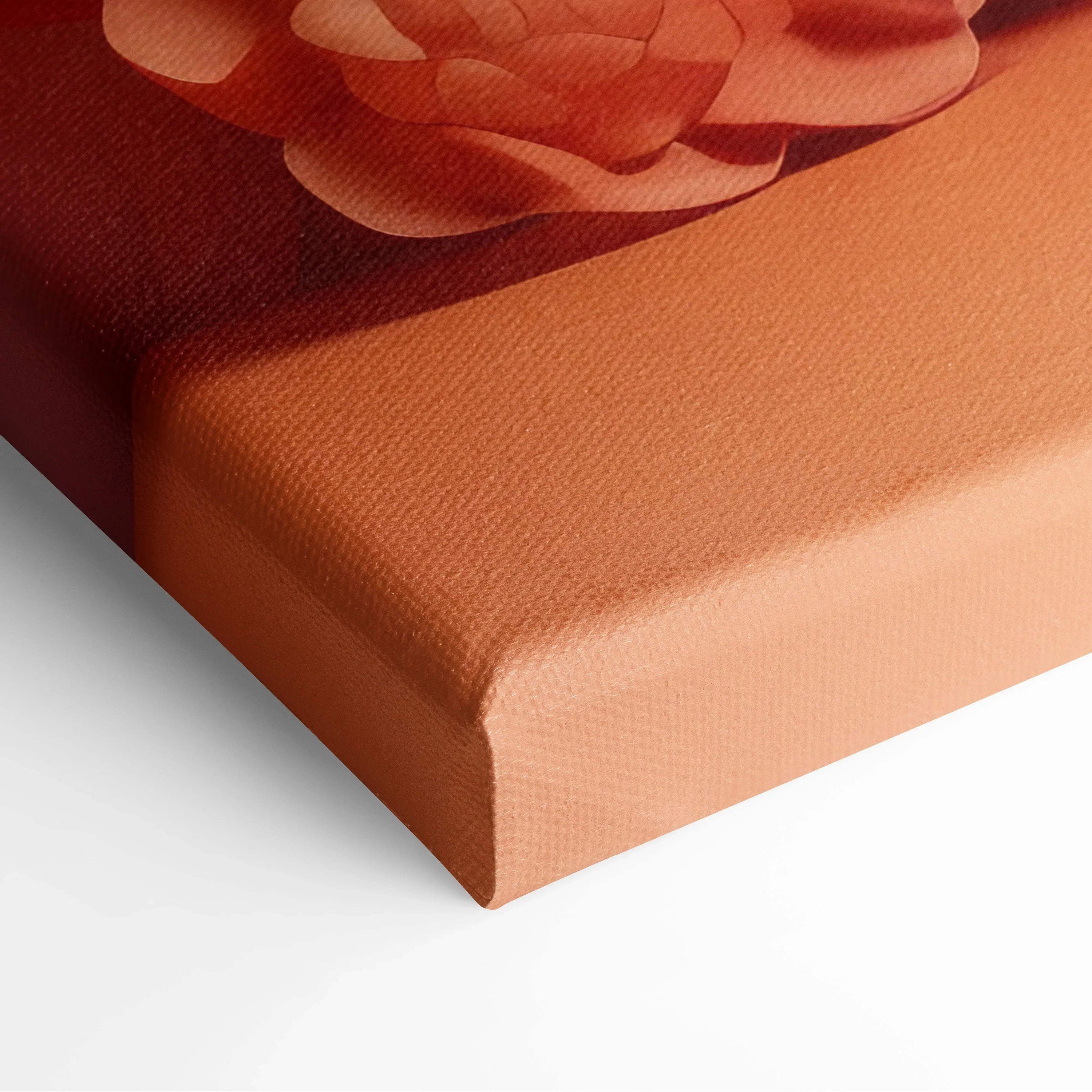 Close-up of modern abstract digital art canvas print with warm red and orange tones and textured surface.