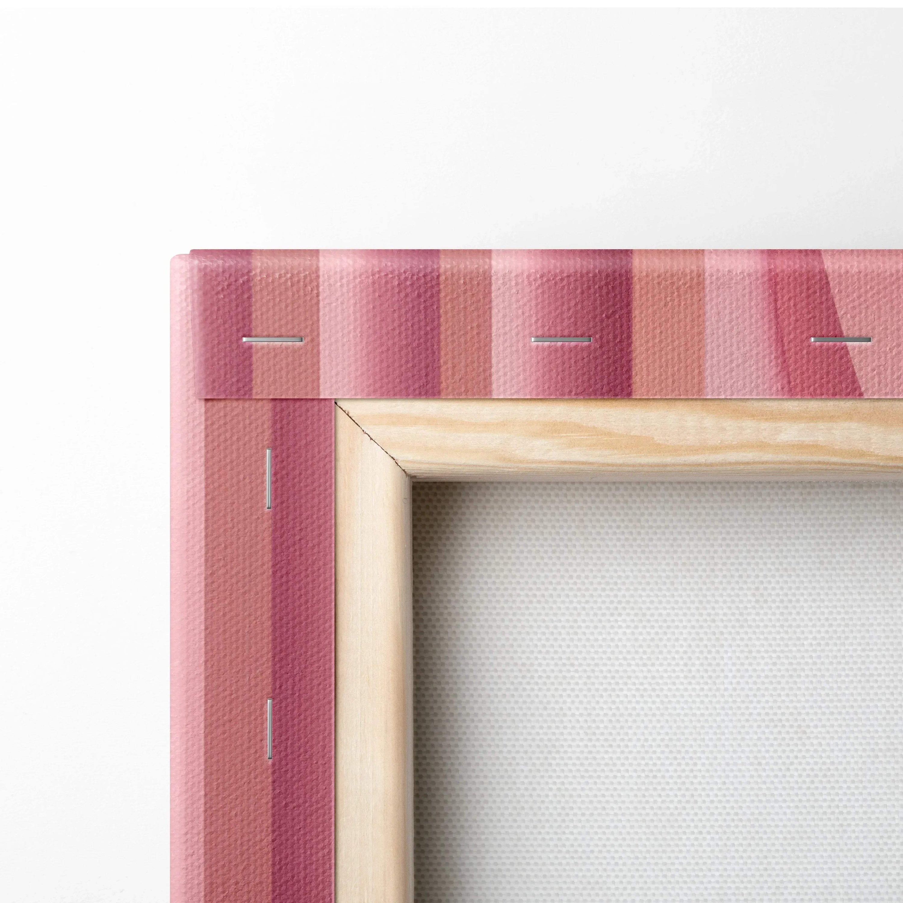 Close-up of wooden frame and pink striped edge of modern abstract digital canvas wall art print.