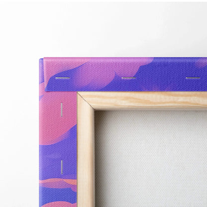 Close-up of vibrant abstract canvas art with bold purple and pink brushstrokes on wooden stretcher frame.