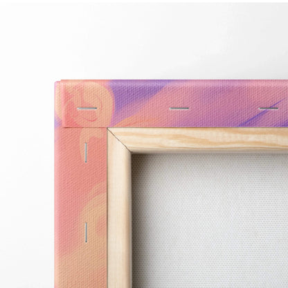 Close-up of canvas corner with abstract pink and purple gradient print stretched over wooden frame with visible staples.