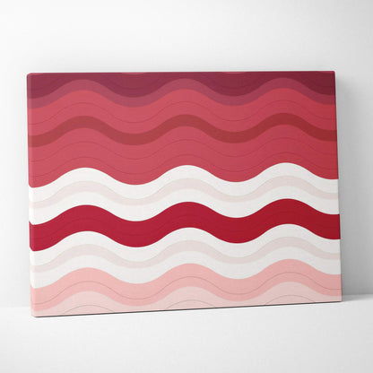 Abstract wavy lines in shades of red, pink, and white on modern canvas wall art.