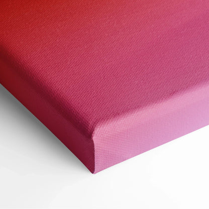Close-up of vibrant pink canvas art with textured surface and neatly wrapped edges for wall hanging.