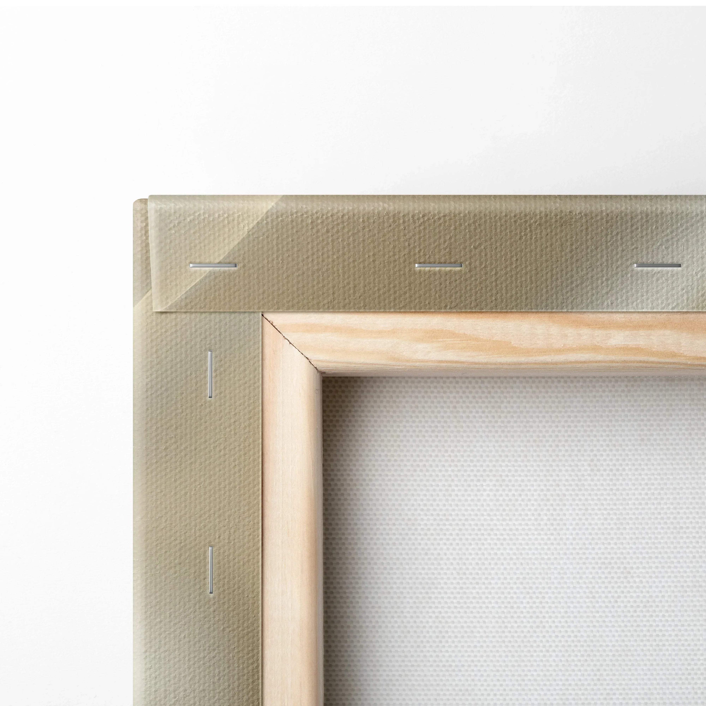 Close-up of canvas art stretcher bars with beige fabric wrapped and stapled on a wooden frame for wall decor.
