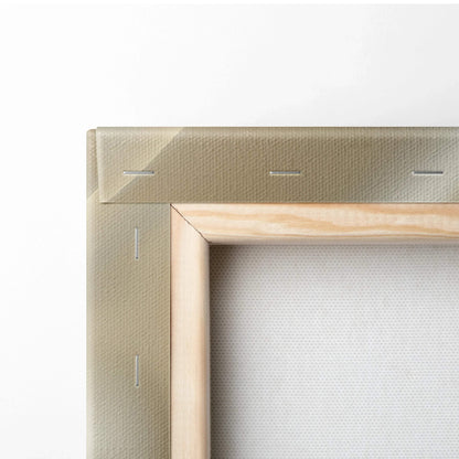 Close-up of canvas art stretcher bars with beige fabric wrapped and stapled on a wooden frame for wall decor.