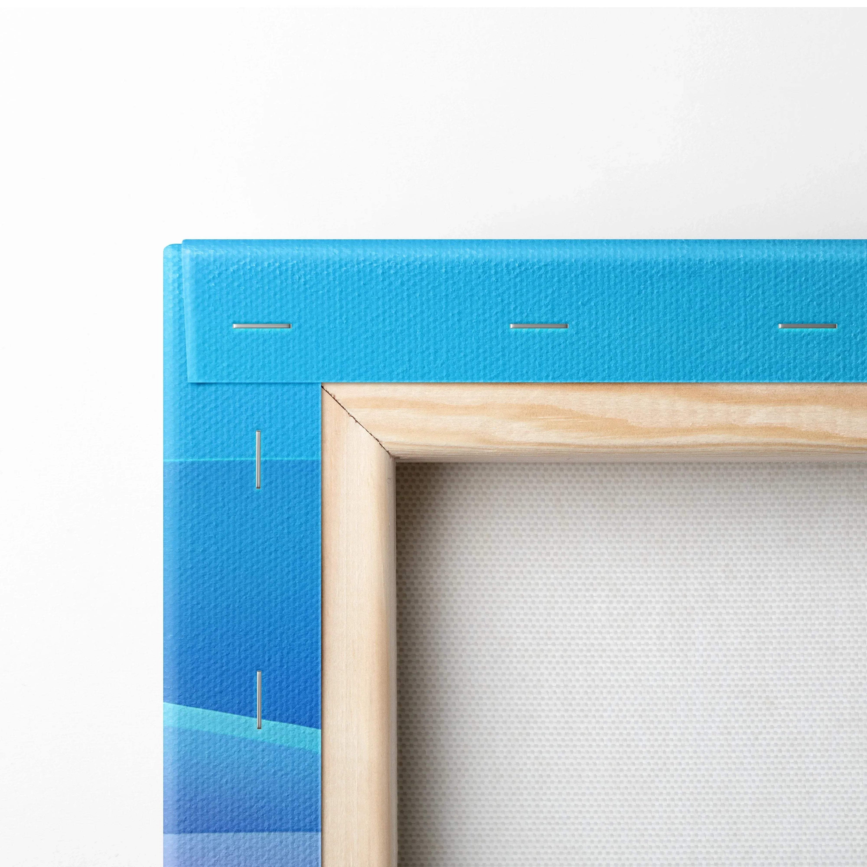 Close-up of canvas wall art corner with blue abstract digital print and wooden frame edges visible.