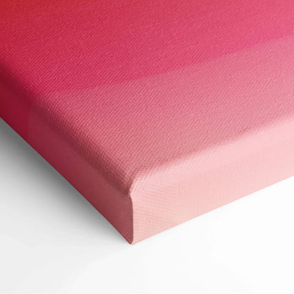Close-up of pink gradient digital canvas art with textured fabric surface and sharp wrapped edges.
