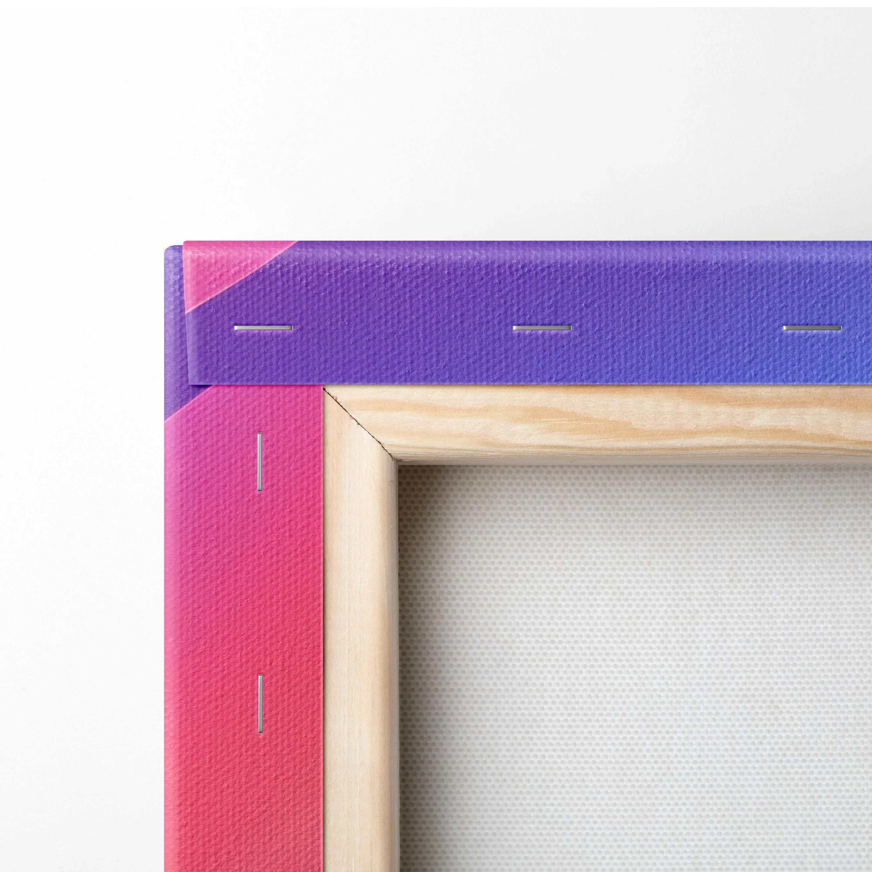 Close-up of wooden framed canvas art stretched with vibrant purple and pink abstract print on fabric wall art.