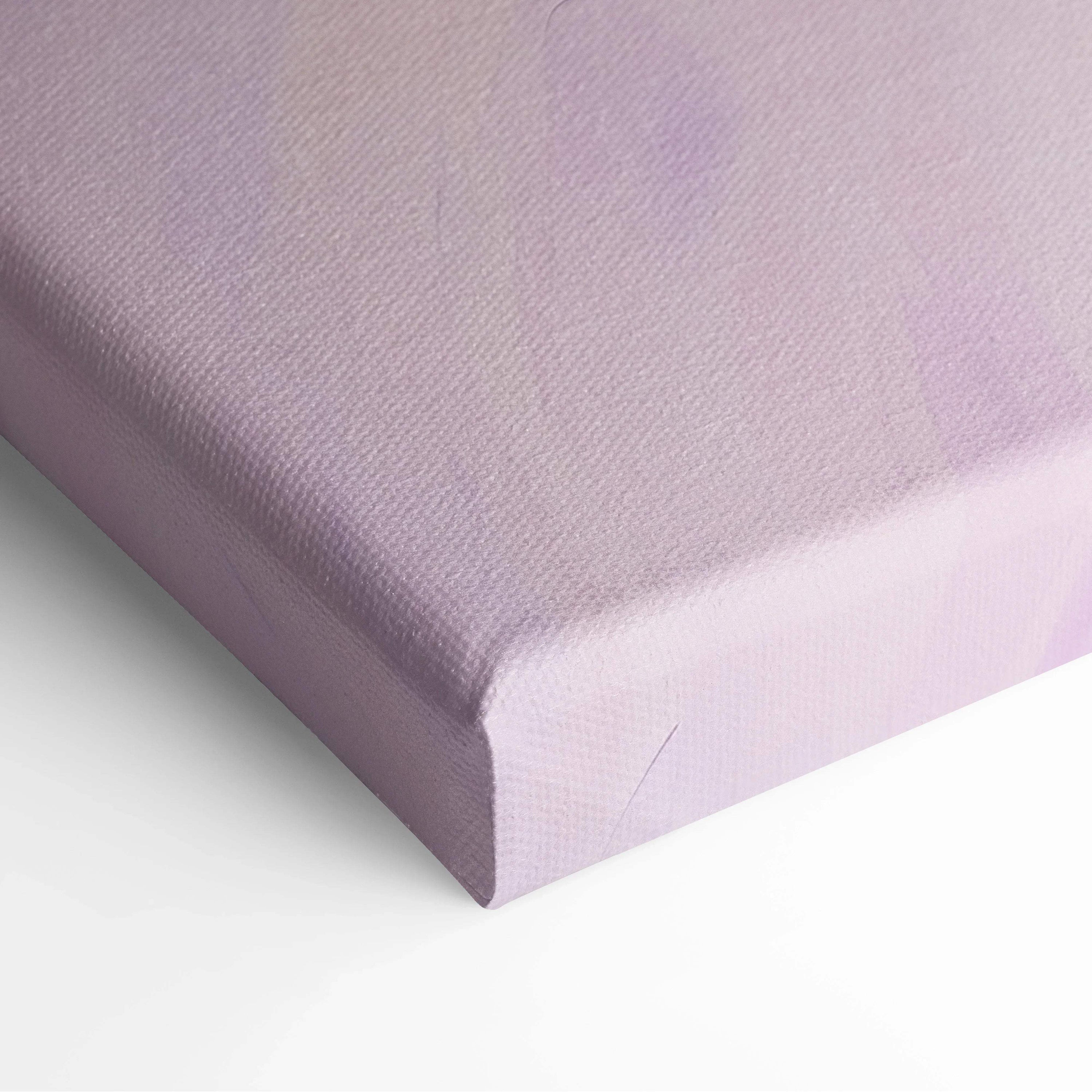 Close-up of modern abstract digital art canvas wall art featuring soft lavender and light purple tones on stretched canvas.