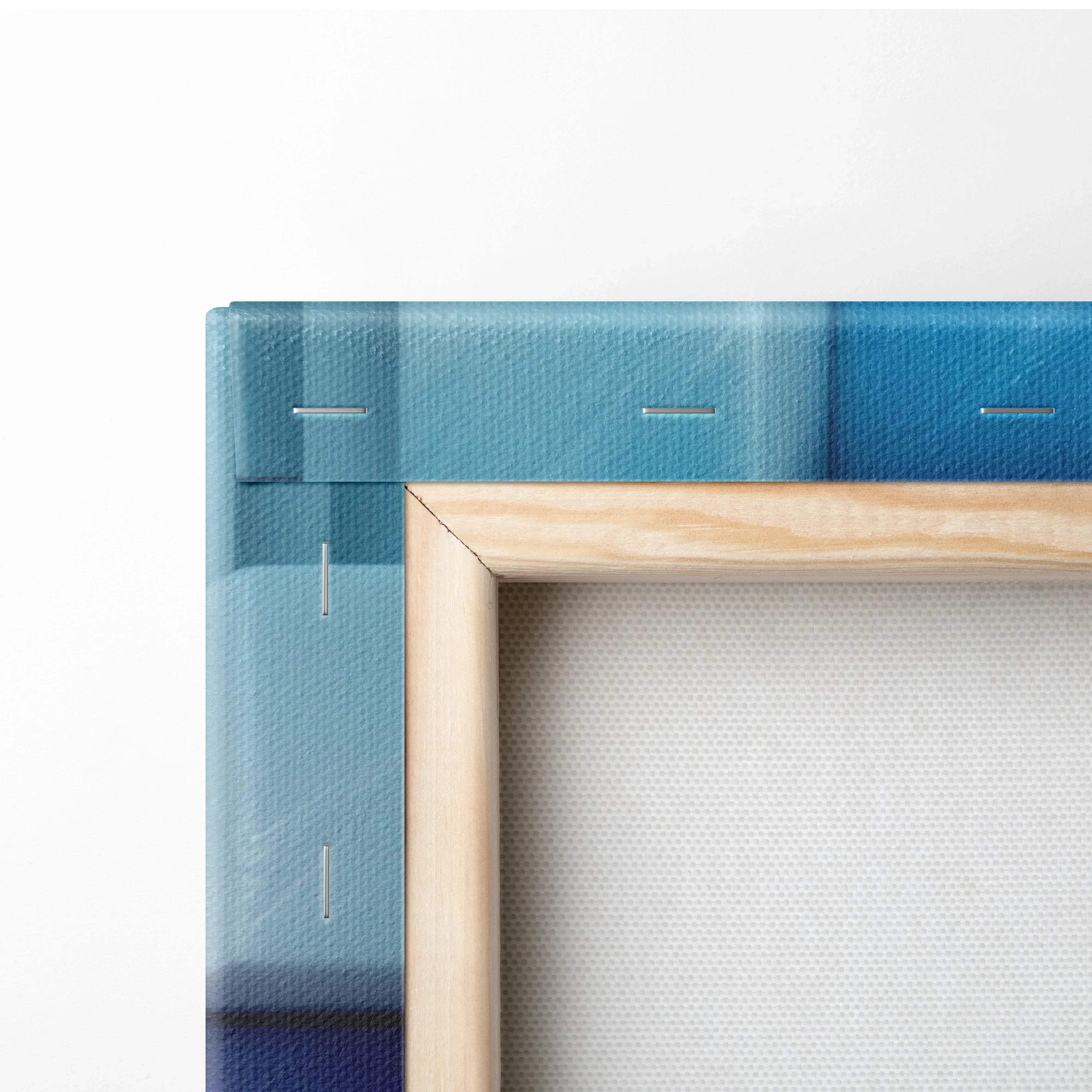 Close-up of vibrant blue abstract canvas art with teal and sky blue shades, wooden frame visible from the back.