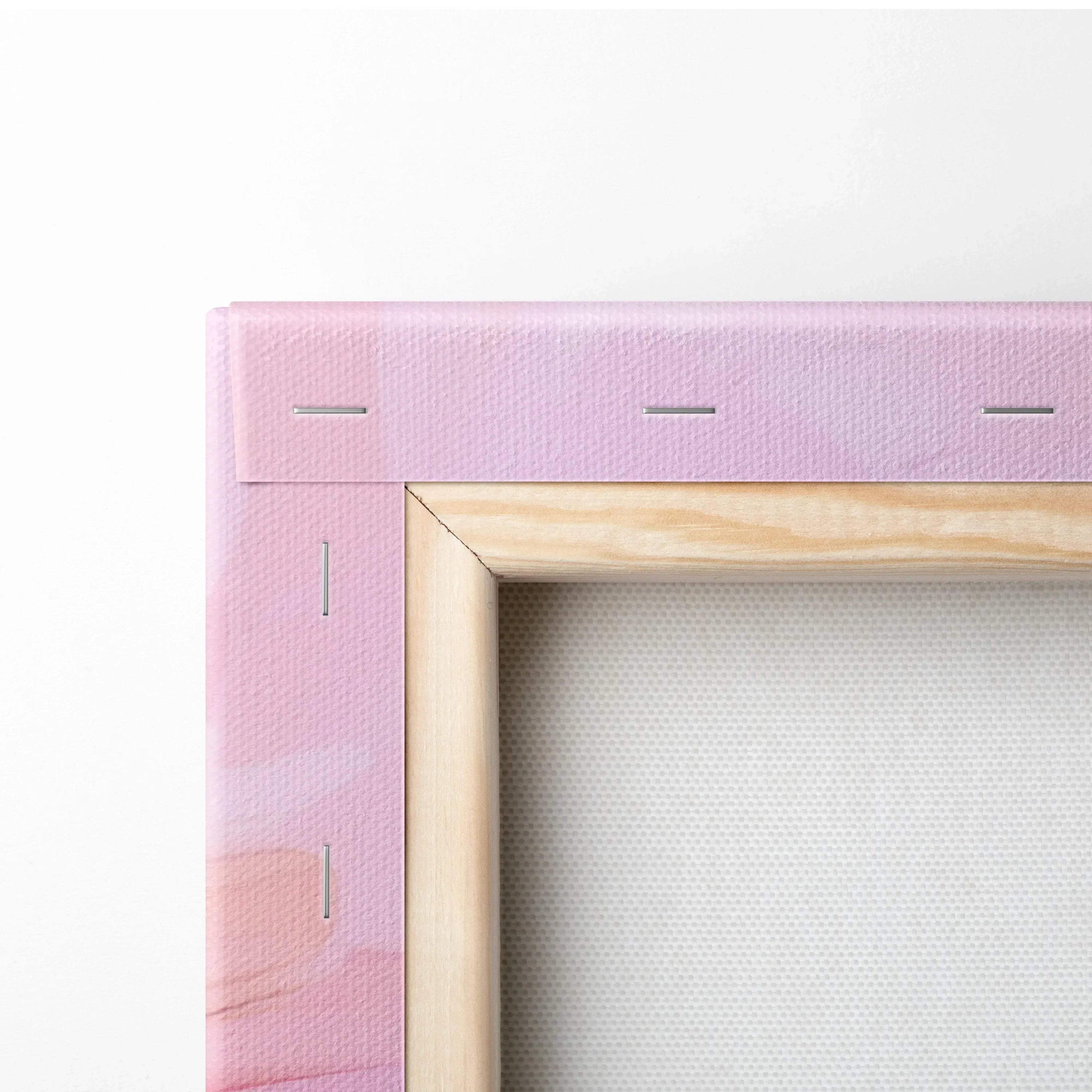 Close-up of pink abstract digital art on stretched canvas with wooden frame and visible staples.
