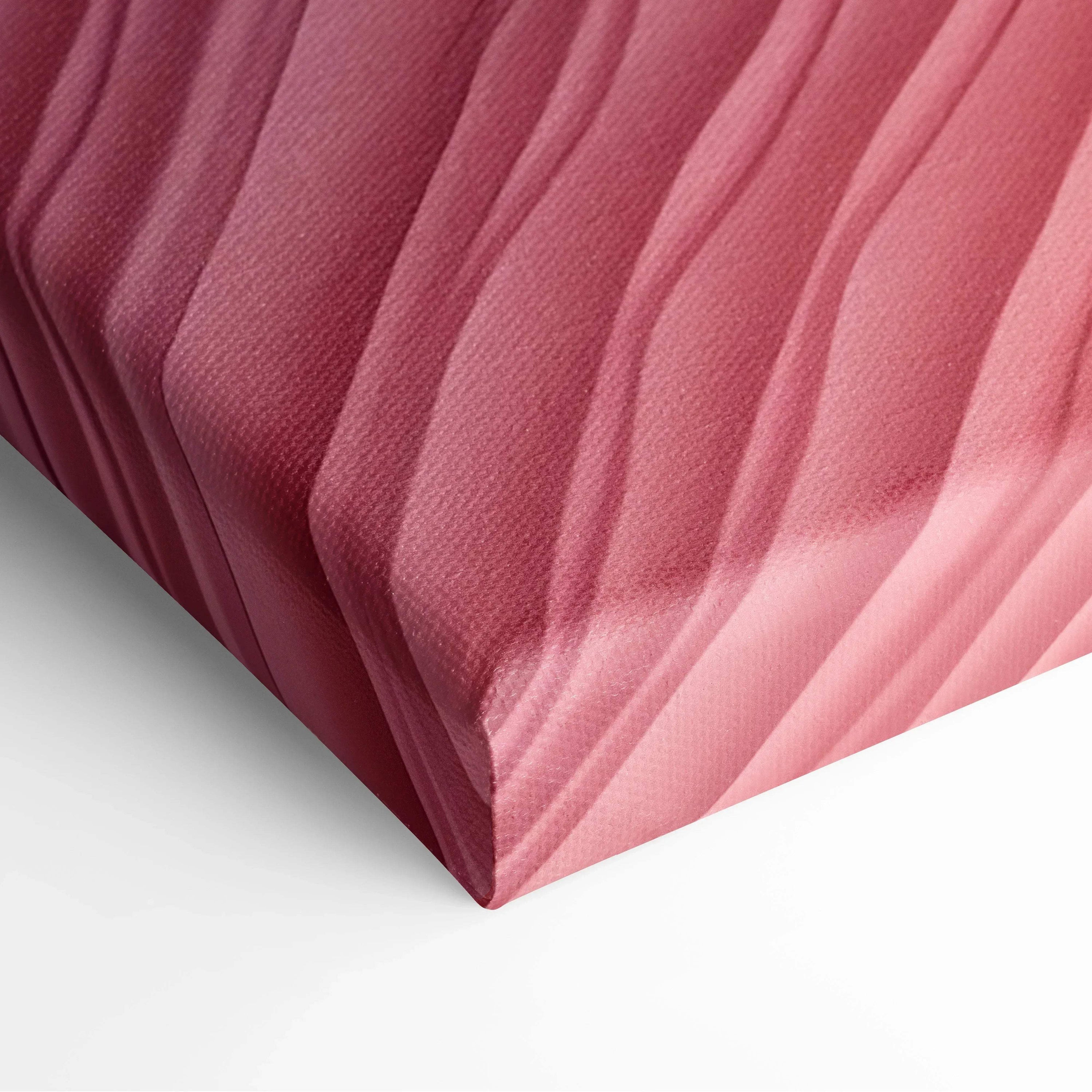 Close-up of modern abstract digital canvas art with textured pink and red gradient waves on wall art canvas.