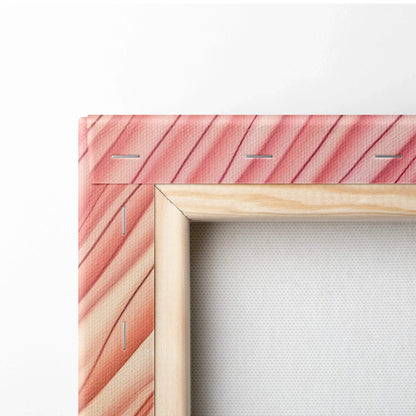 Close-up of canvas art corner with pink and red diagonal stripes stretched over wooden frame with visible staples and white.