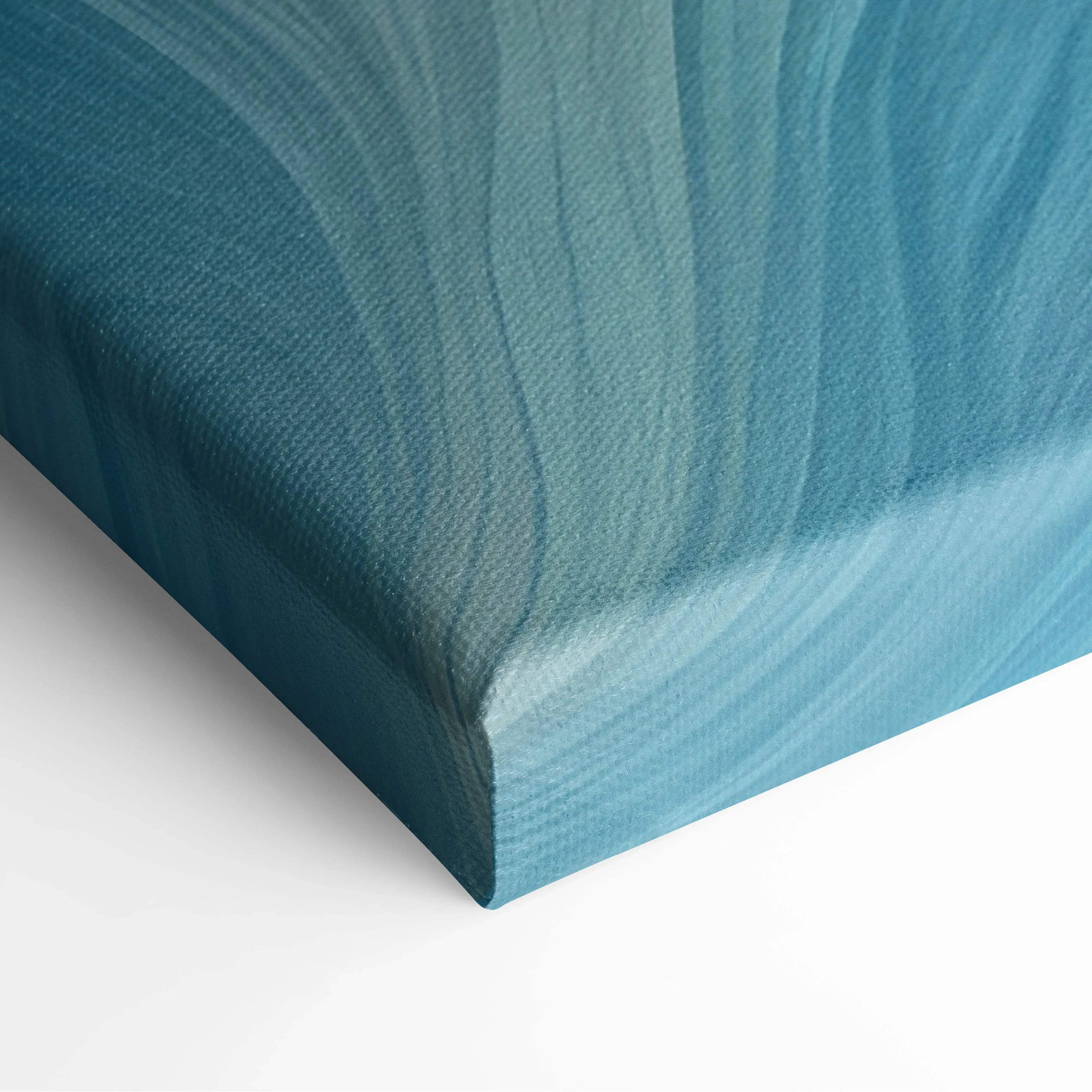 Blue and teal abstract digital pattern on stretched canvas wall art with subtle textured lines.