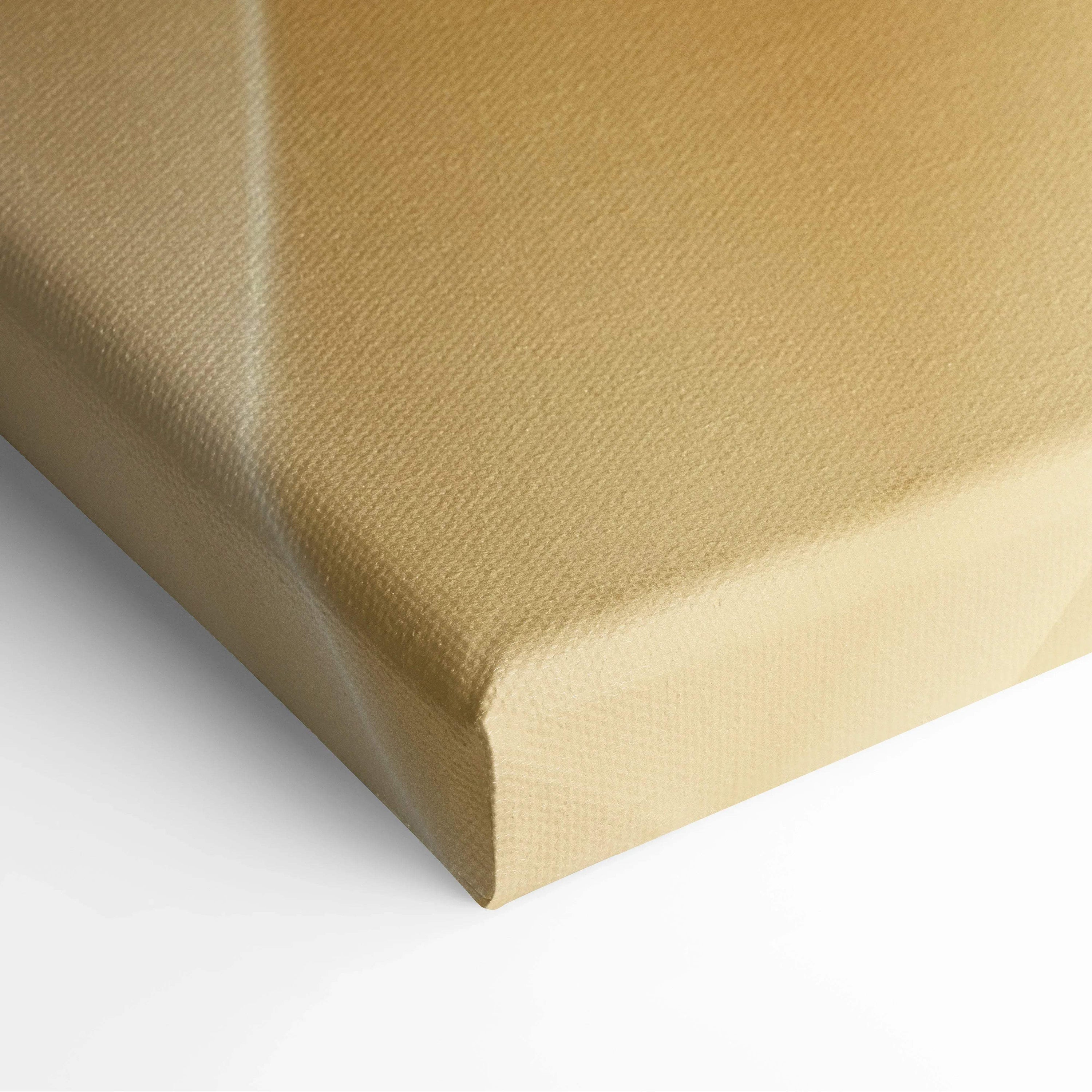 Close-up of beige canvas stretched over wooden frame with textured surface for wall art display.