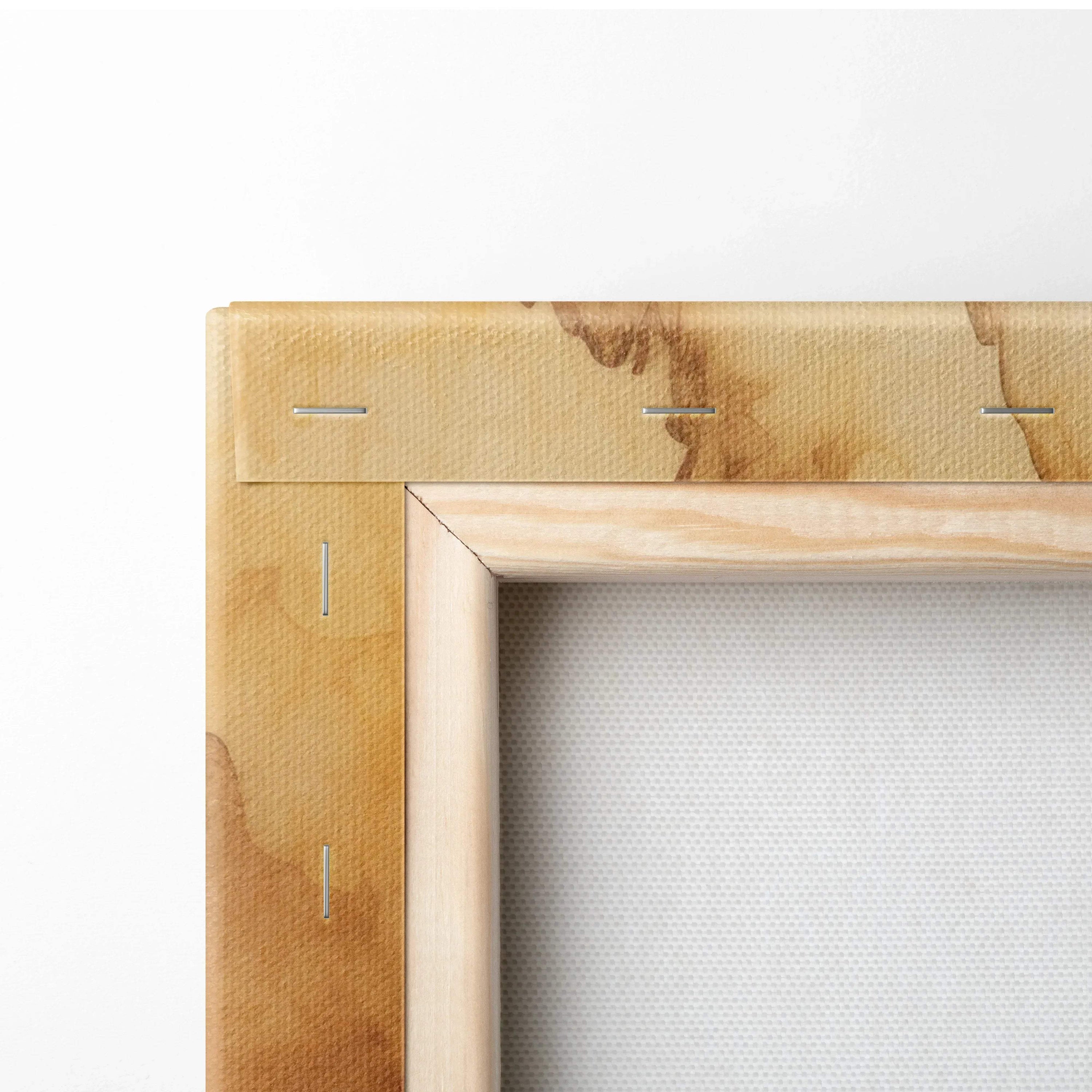 Close-up of wooden frame corner showing canvas stretched and stapled, natural wood tones, textured white canvas surface.