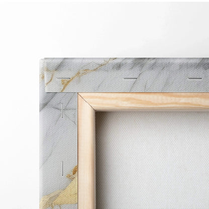 Close-up of canvas art corner with gray and gold abstract design stretched on wooden frame.