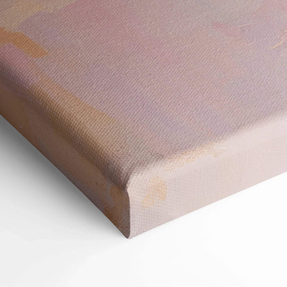Close-up of a modern abstract canvas art print with soft pastel pinks and subtle beige tones on textured fabric.