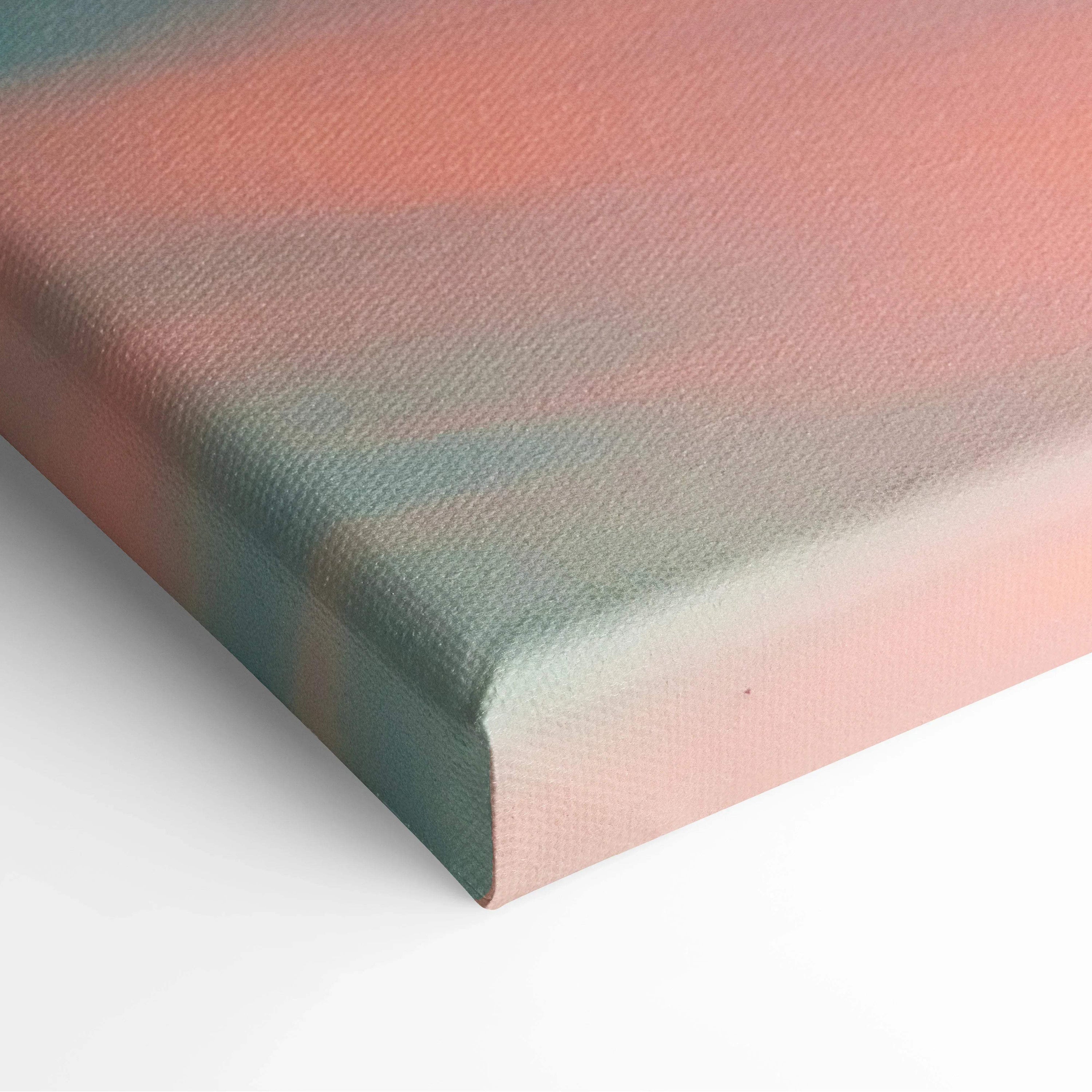 Abstract sunset colors in soft pink and teal tones on textured canvas wall art corner close-up.