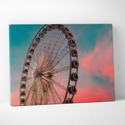 Sunset Ferris wheel canvas wall art with pink and blue sky background.