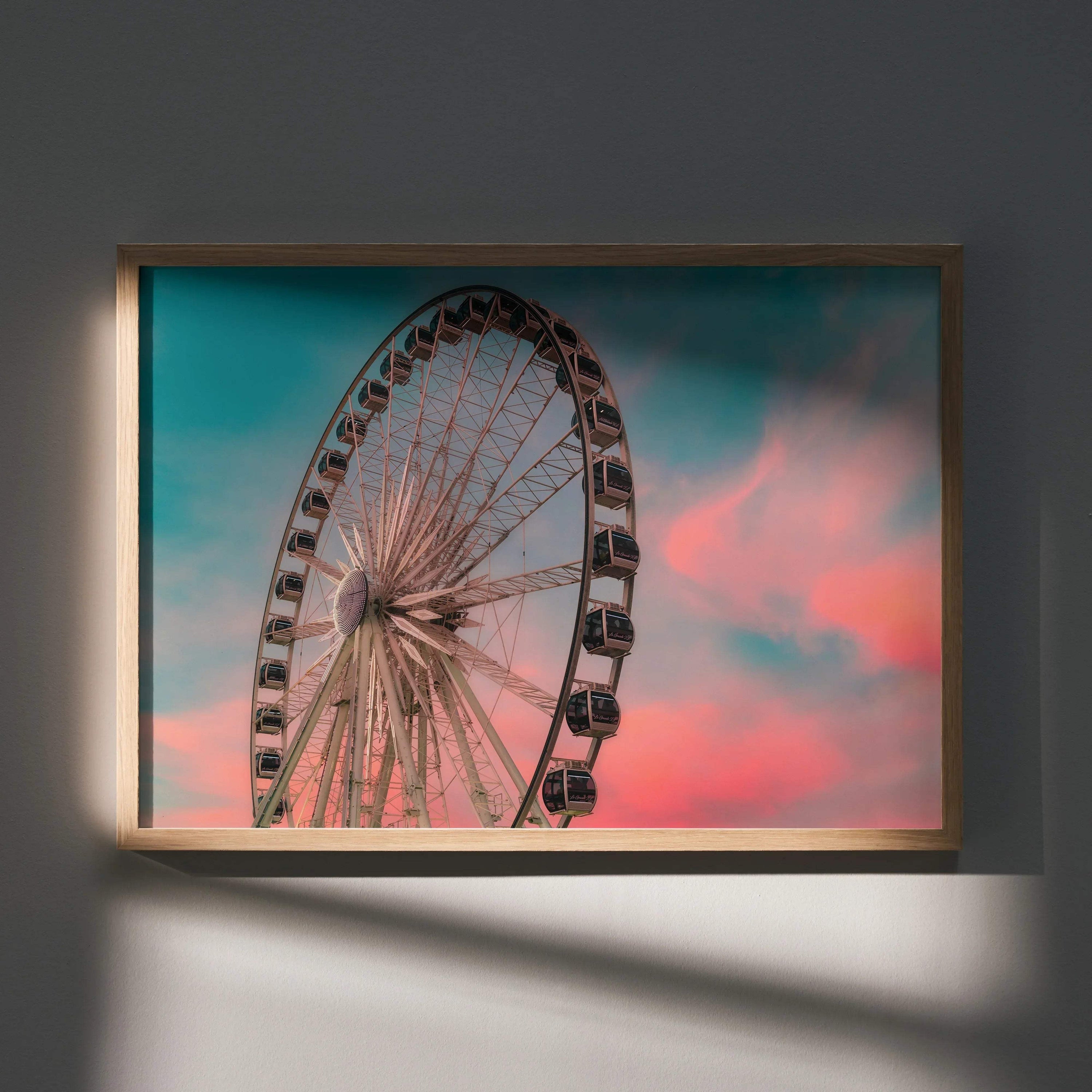 Ferris wheel against colorful sunset sky poster wall art with vibrant pink and blue hues.