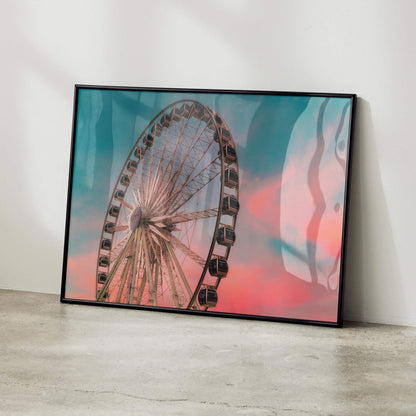 Vibrant sunset sky behind Ferris wheel poster in black frame wall art.