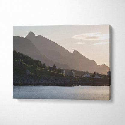 Majestic mountain sunset canvas wall art with soft pink sky and silhouetted peaks over calm water.