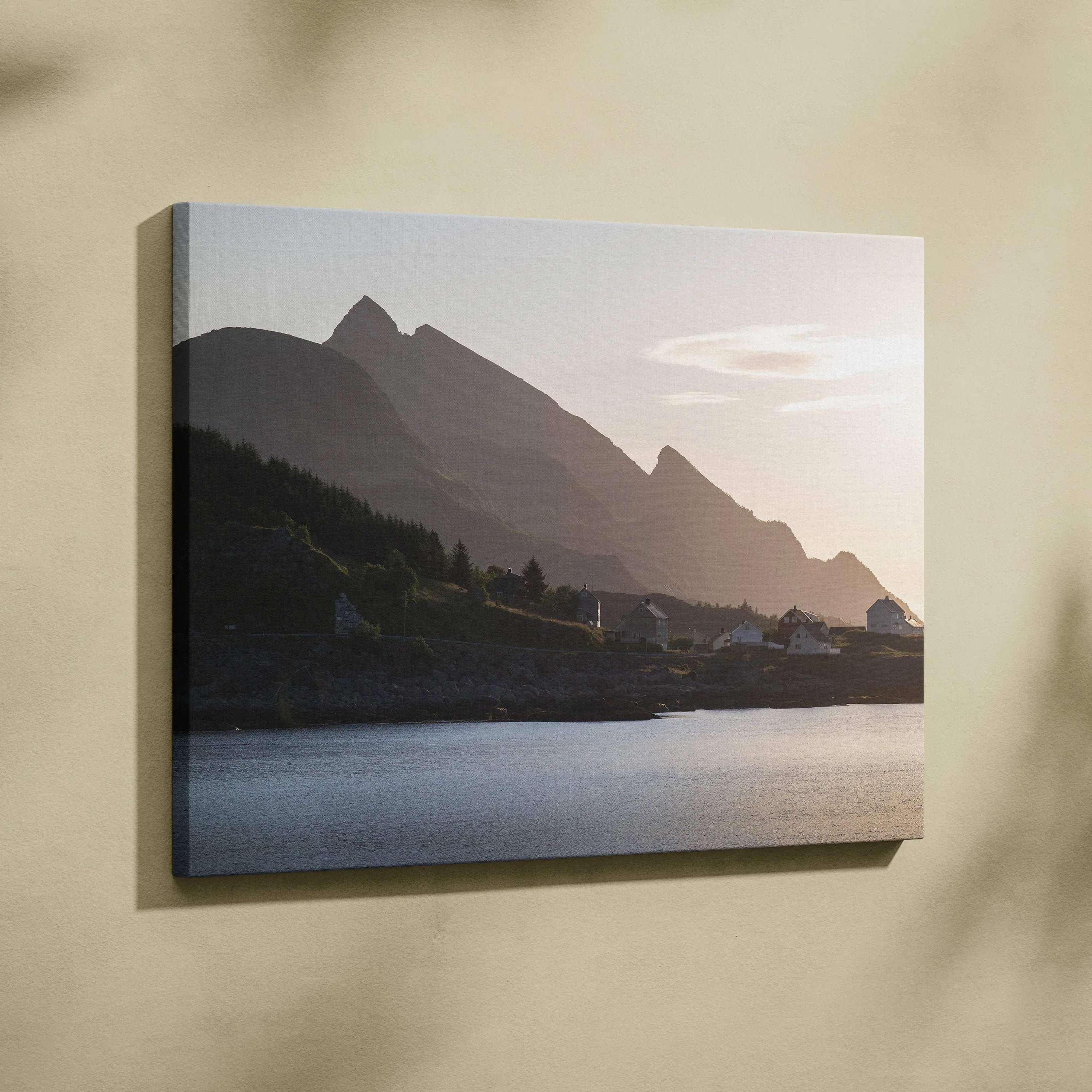 Canvas wall art featuring a serene mountain landscape at sunset with muted colors and calm water.