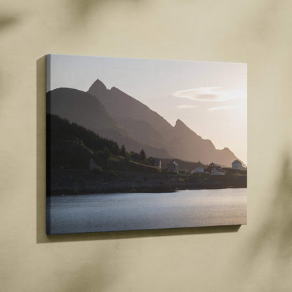 Canvas wall art featuring a serene mountain landscape at sunset with muted colors and calm water.