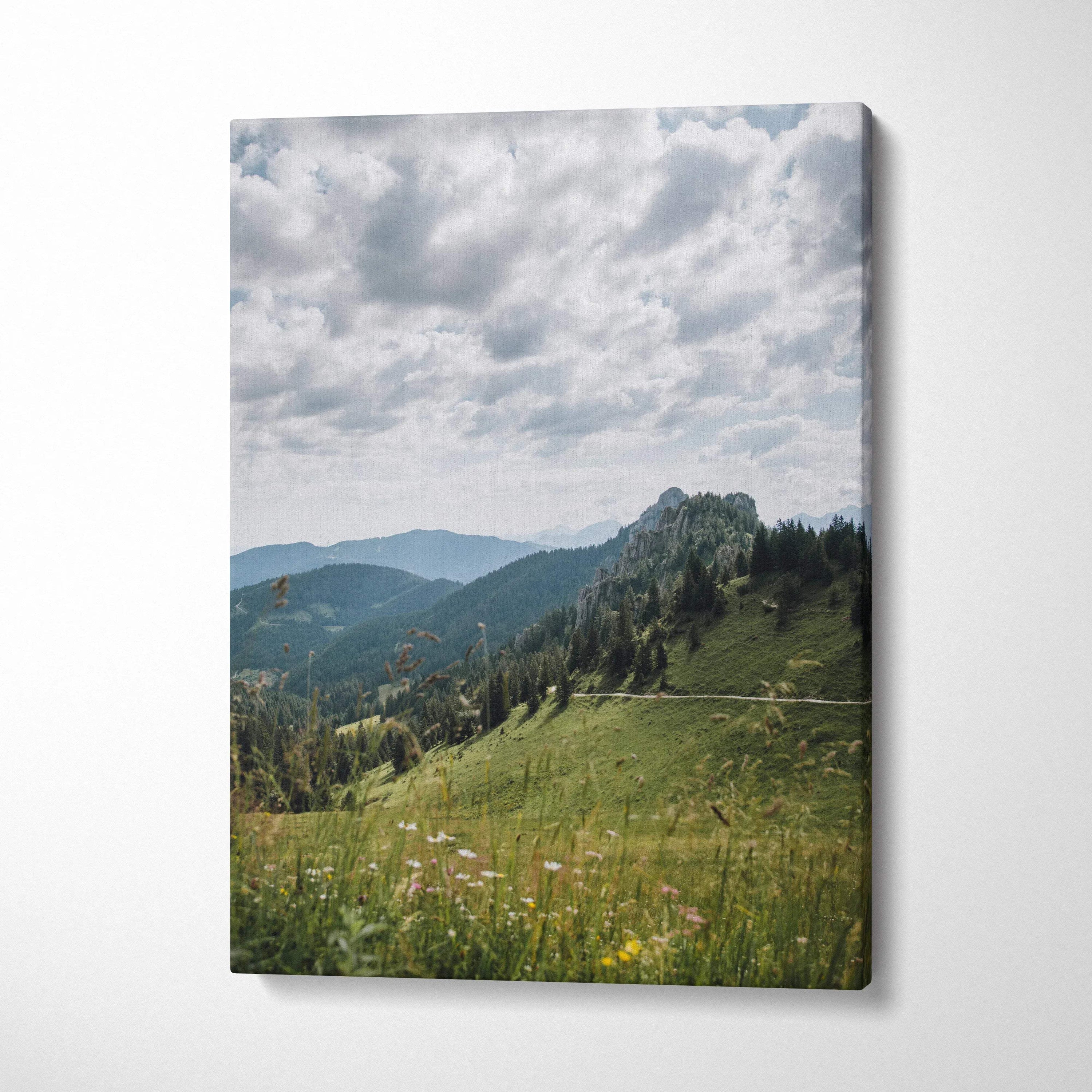 Serene mountain landscape canvas wall art with green hills and cloudy sky.
