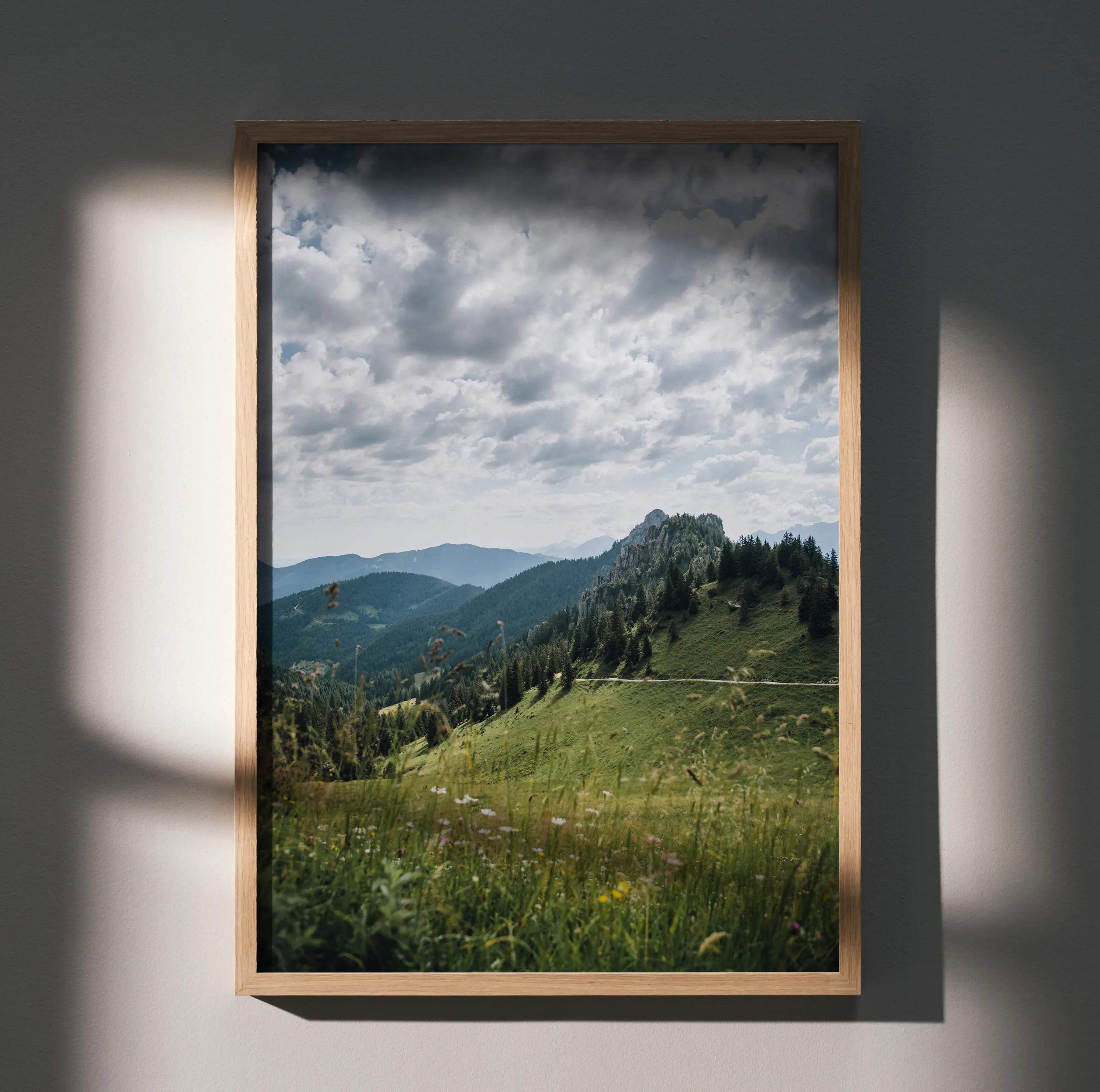 Vertical poster of majestic mountain landscape wall art with cloudy sky and lush green hills.