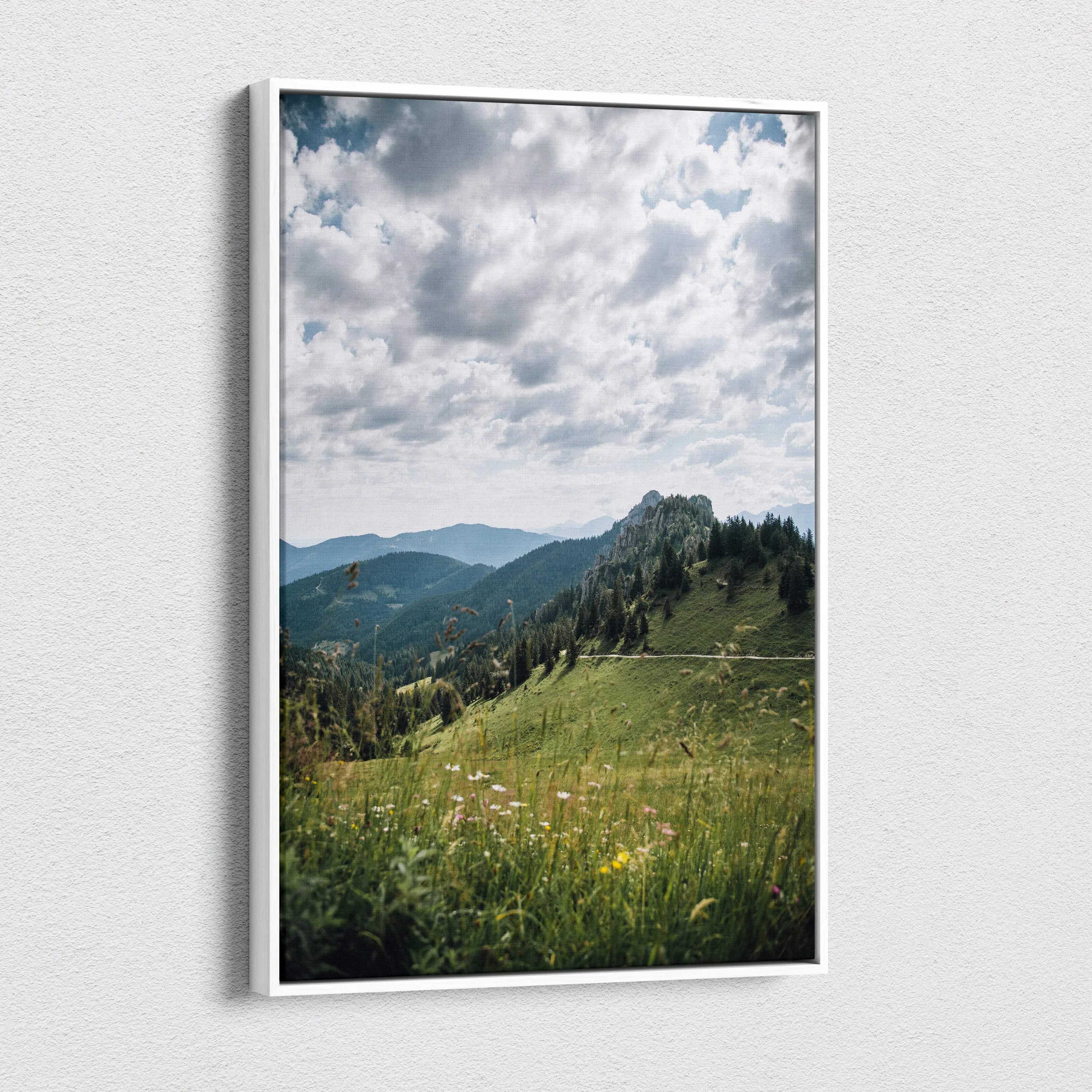 Canvas wall art featuring serene green mountains under a cloudy sky in vertical format.