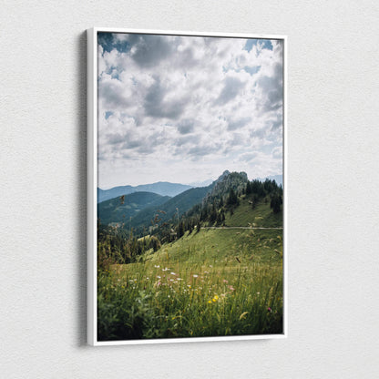 Canvas wall art featuring serene green mountains under a cloudy sky in vertical format.