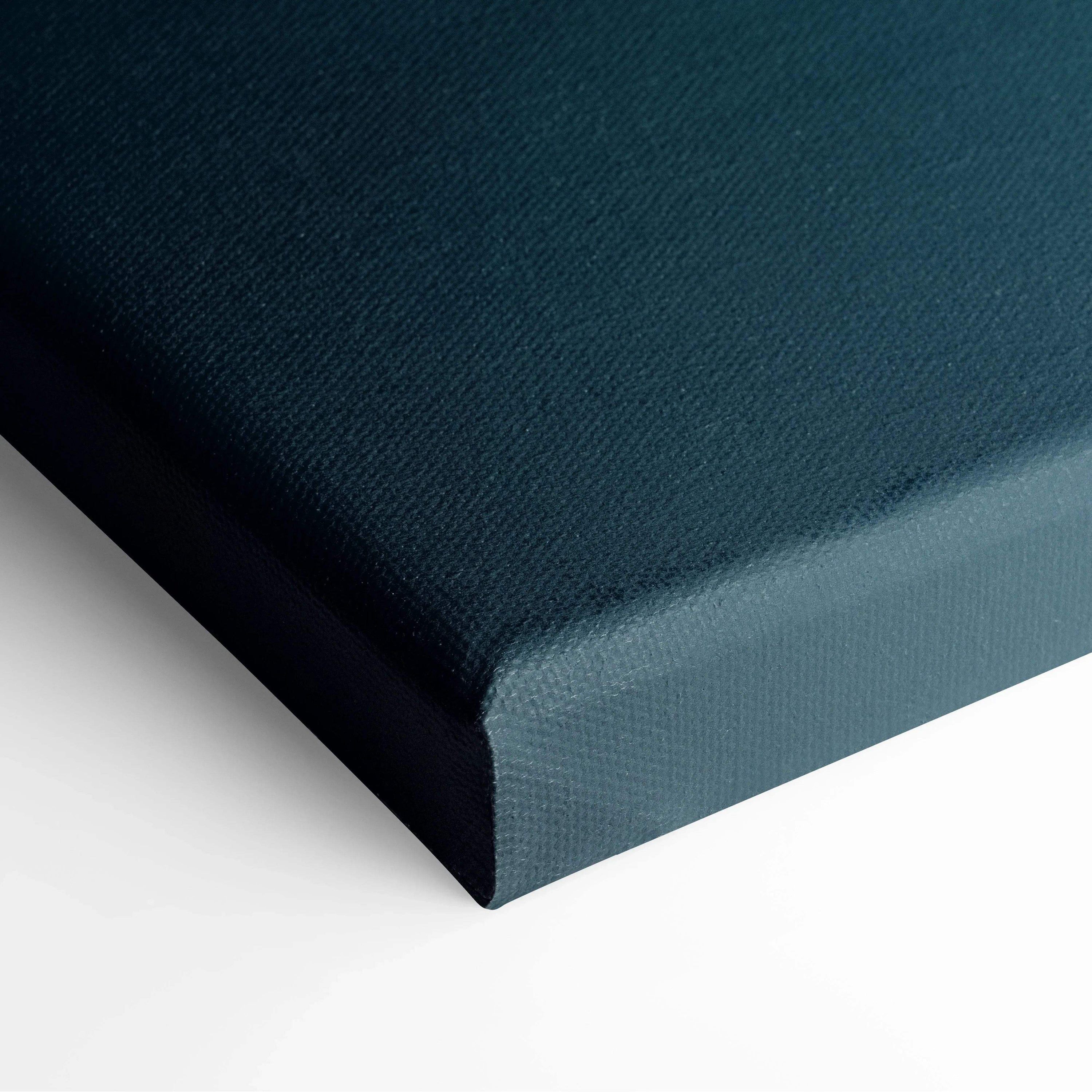Close-up of textured dark blue canvas wall art corner with clean edges and tight wrapping.