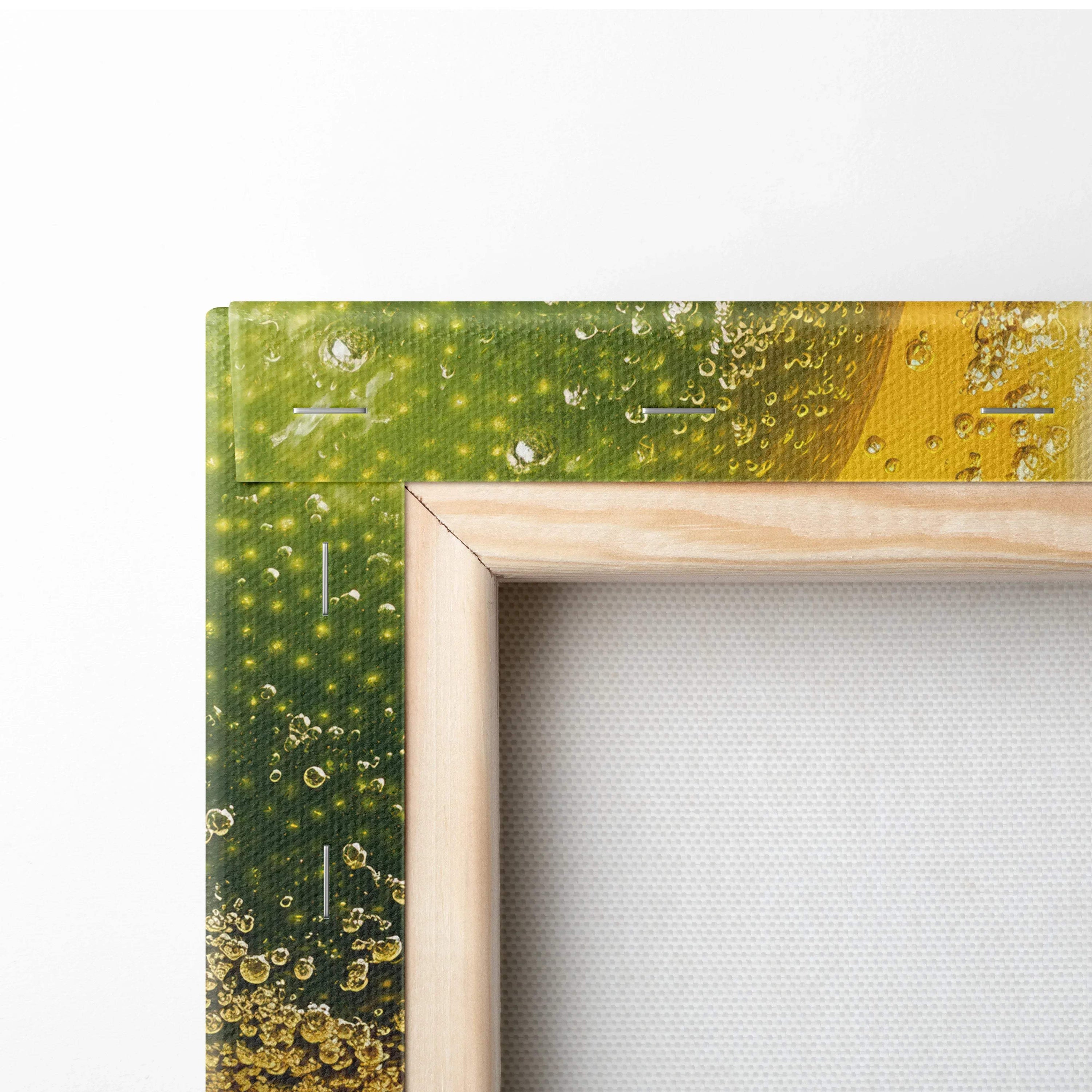 Close-up of vibrant green and yellow food-themed canvas stretched on a natural wood frame wall art.