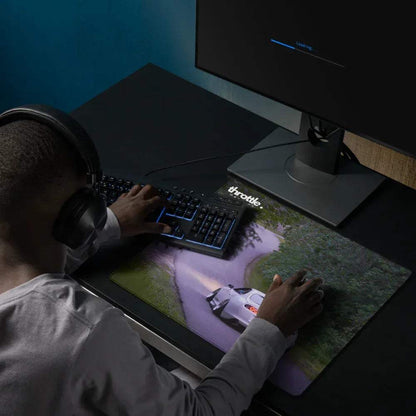 Large Toyota Supra Mk4 gaming mouse pad with car design, extending under keyboard and mouse on desk.