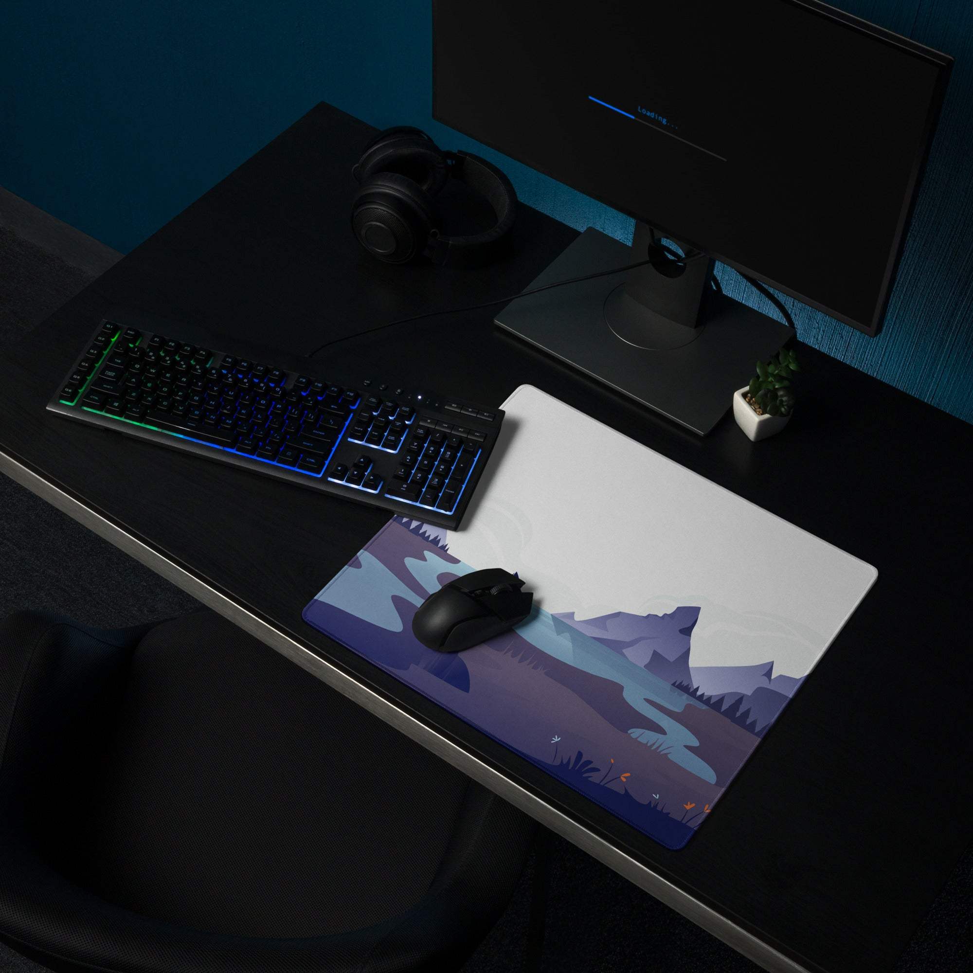 Calm minimalist majestic mountain gaming mouse pad with snowy peaks, serene lake in cool blue dusk tones and black wireless mouse