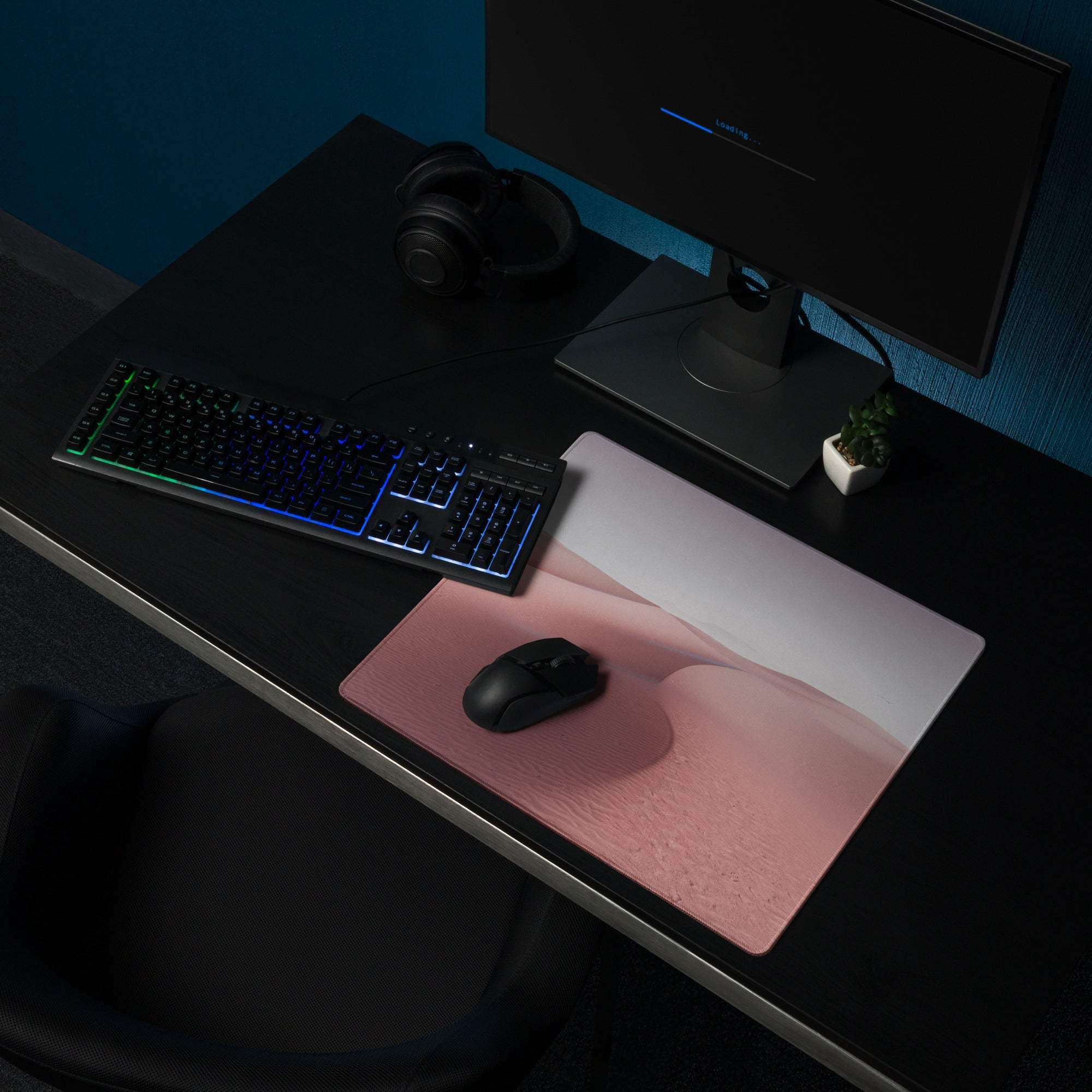 Pink and white desert dune gaming mousepad with black wireless mouse
