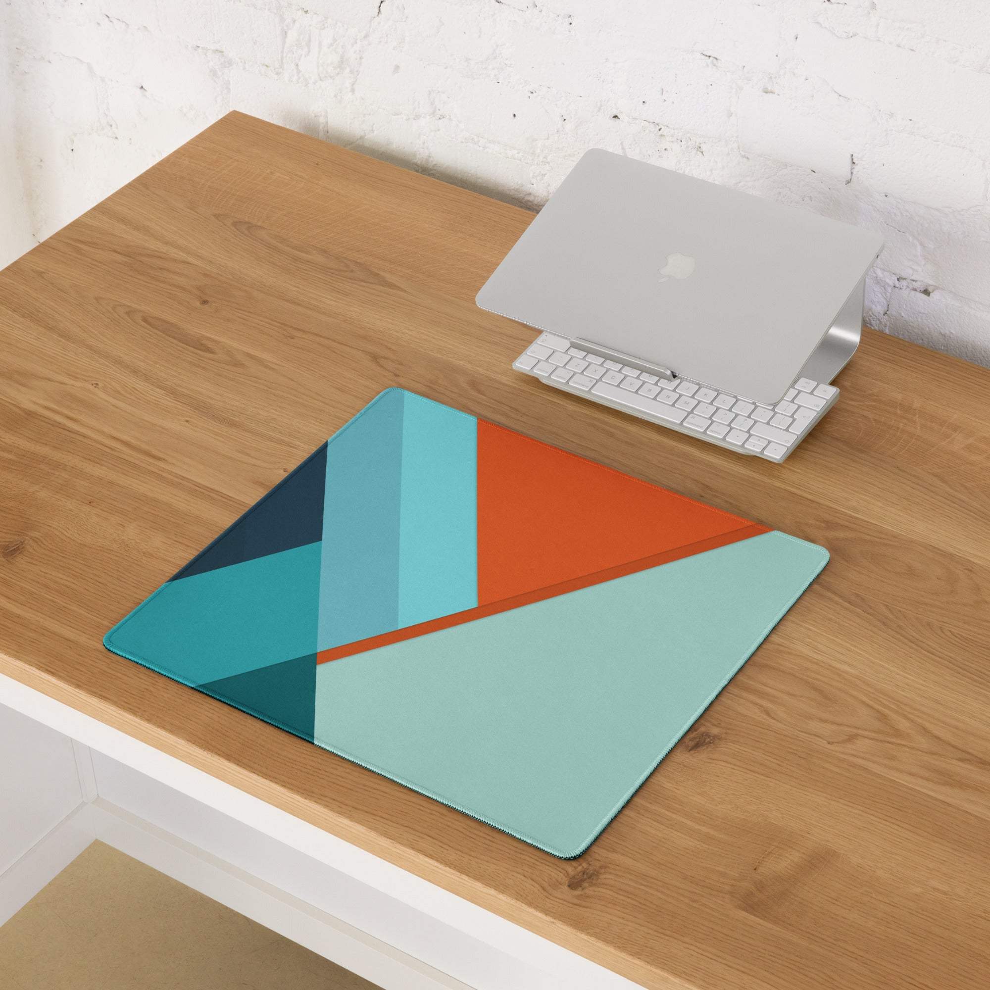 Geometric abstract mouse pad with teal orange triangles on mint green