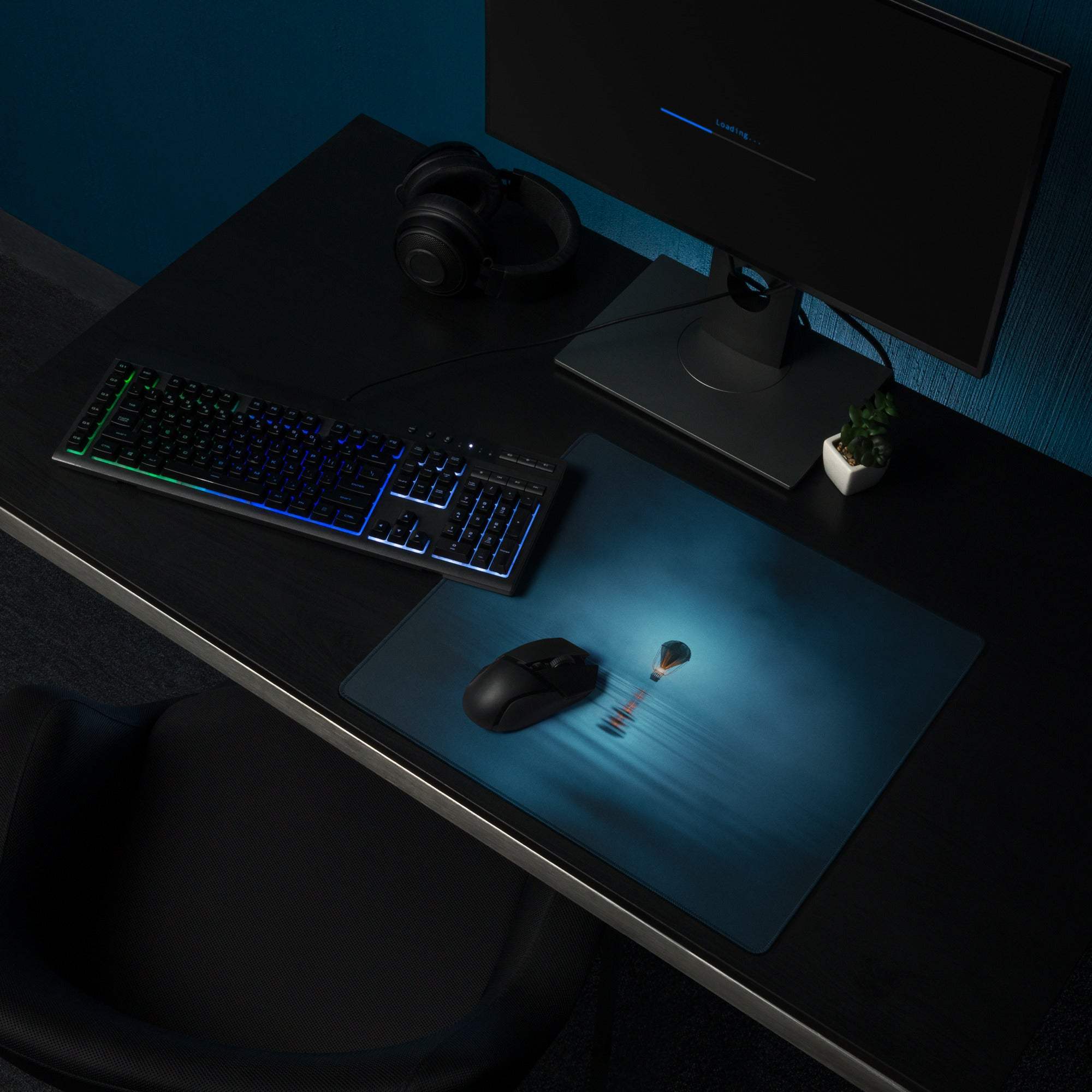 Blue glowing lightbulb mousepad on dreamy ocean blue gaming pad with non-slip base