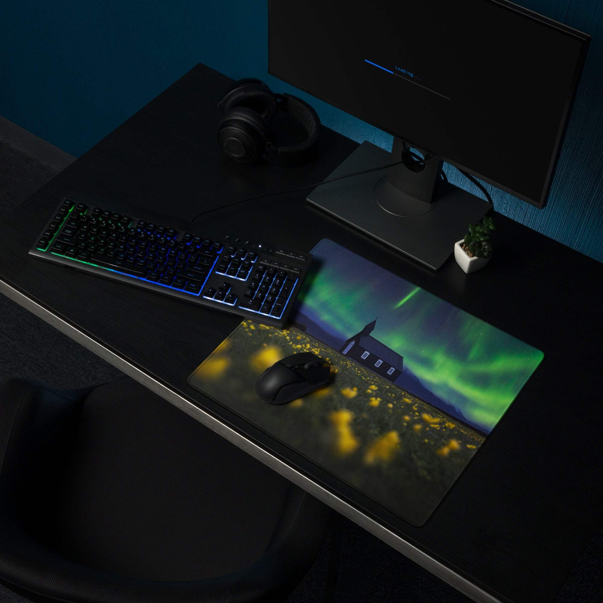 Aurora borealis gaming mouse pad with green-purple lights over fields and house