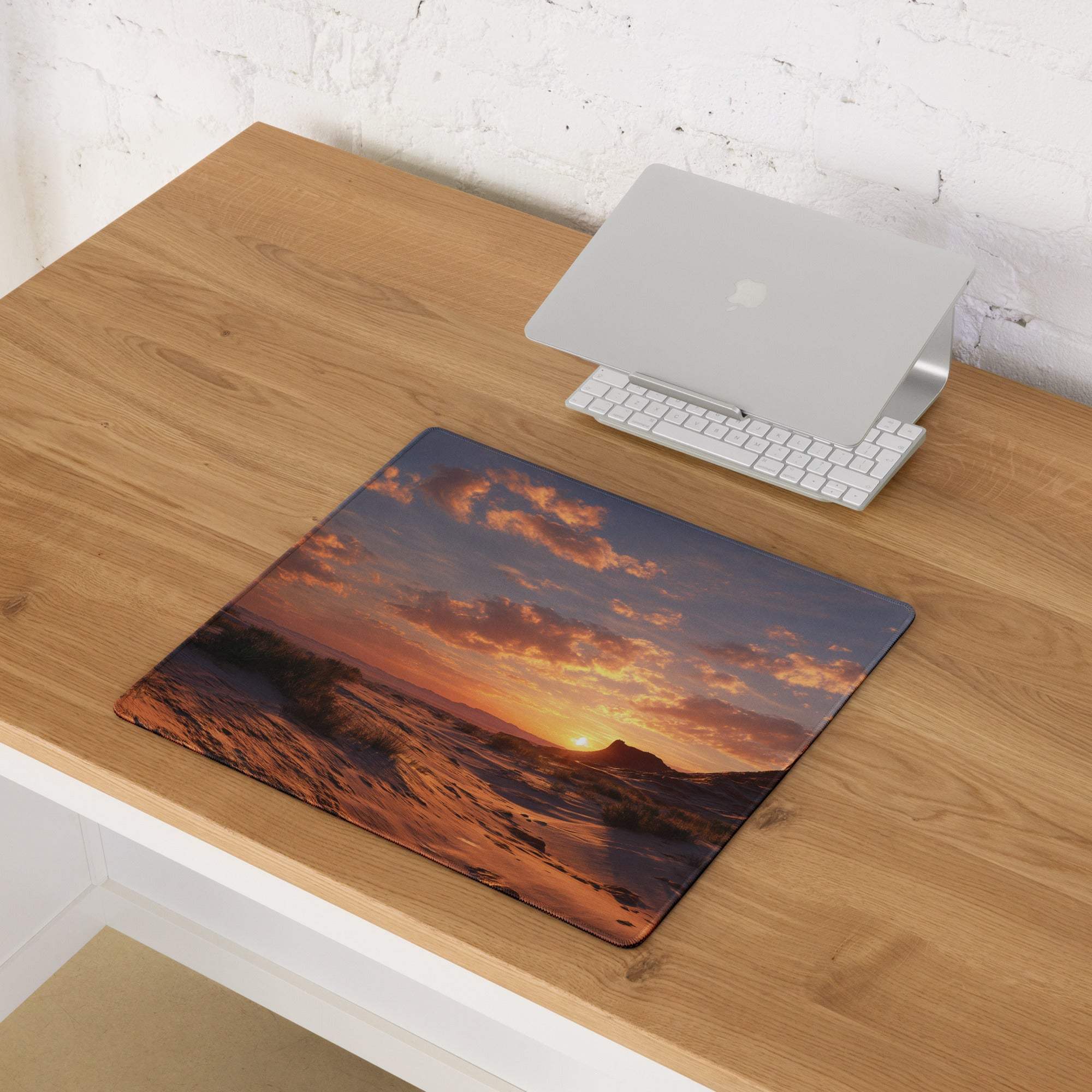 Large cinematic gaming mouse pad with vivid orange sunset over ocean waves