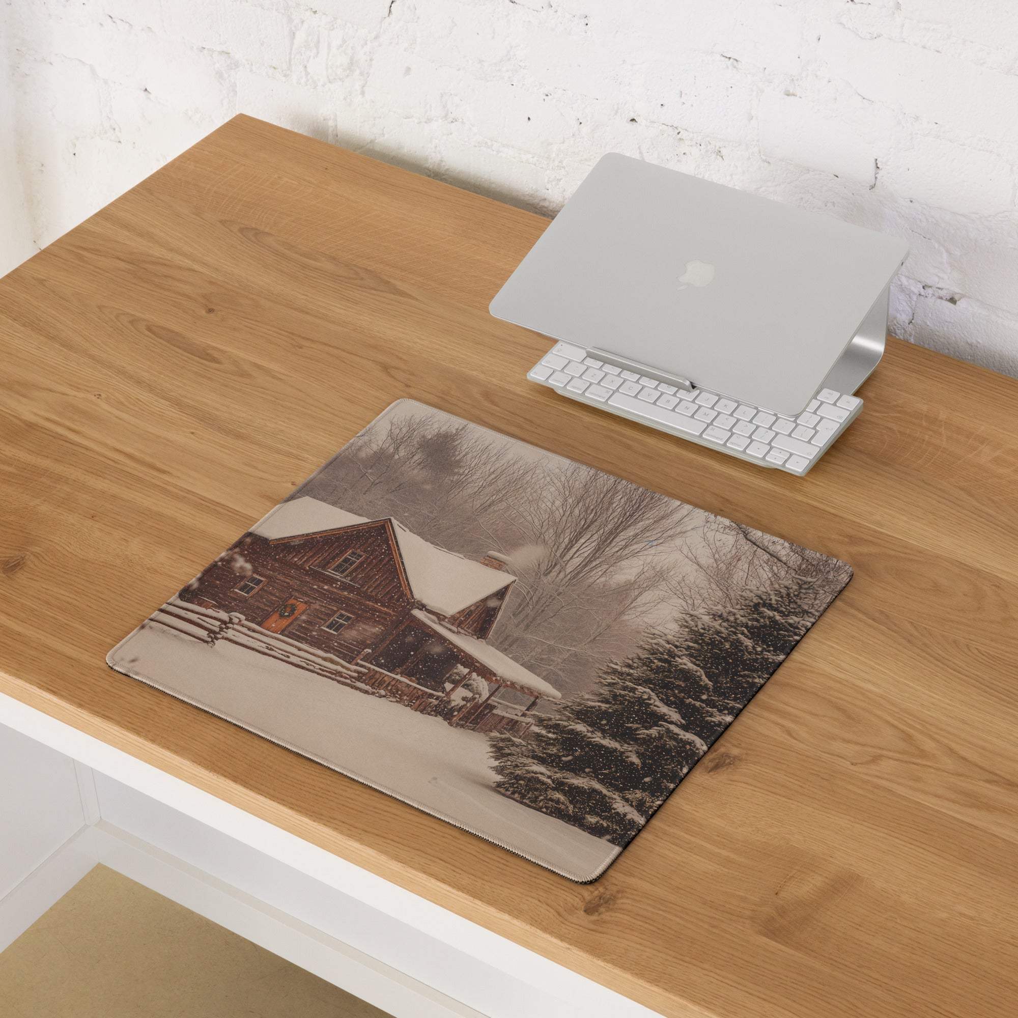 Large rustic winter cabin gaming mouse pad with snow scene and non-slip base