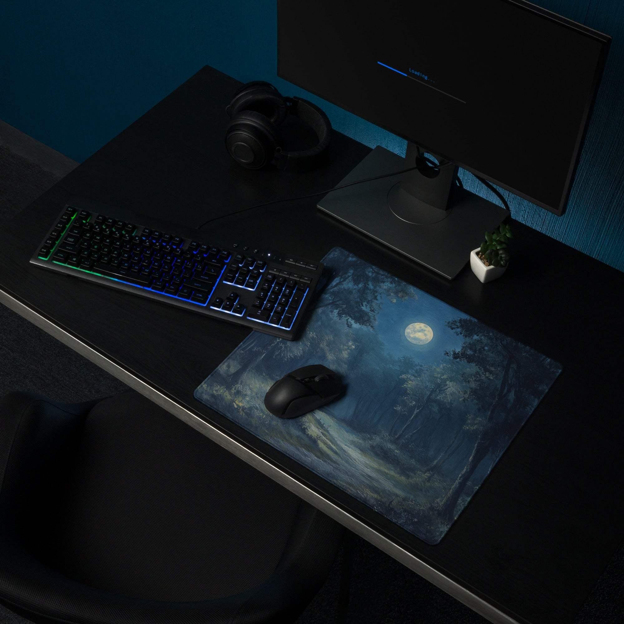 Blue moonlit forest gaming mouse pad with stitched edges and non-slip base