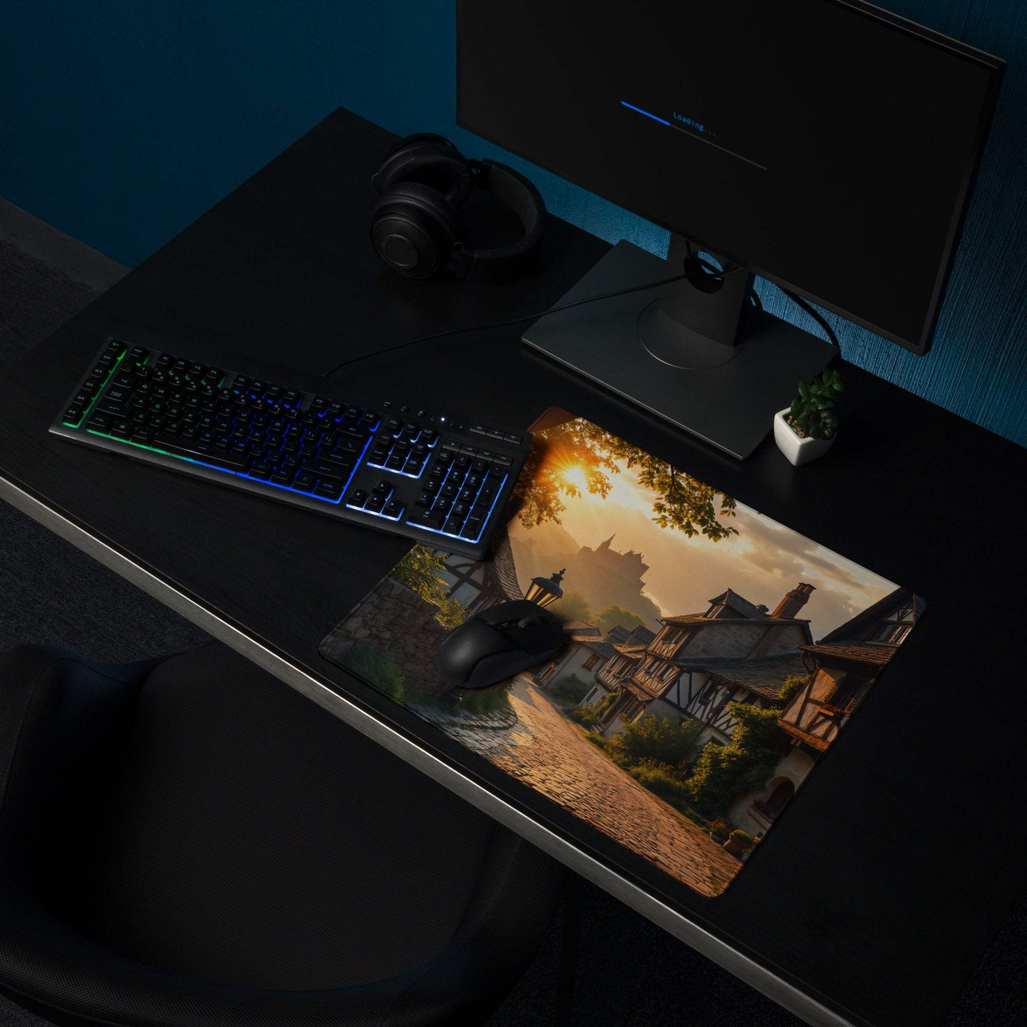 Large extended non-slip gaming mousepad with cinematic sunset village scene in warm golden hour tones