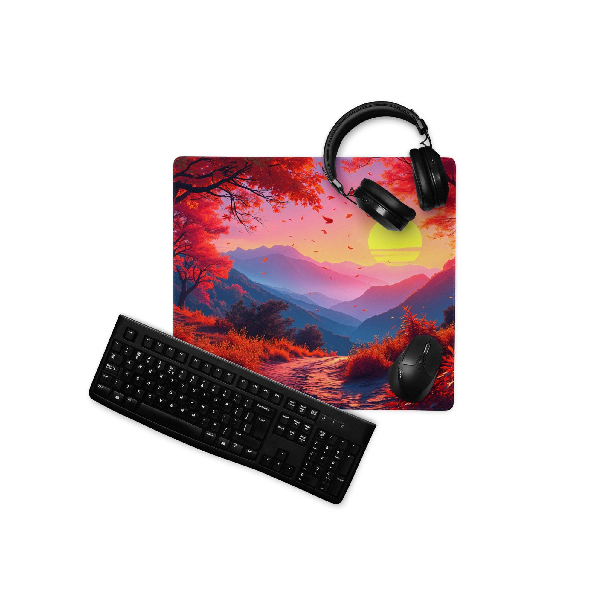 Black matte QWERTY keyboard angled left on vibrant sunset forest gaming mouse pad