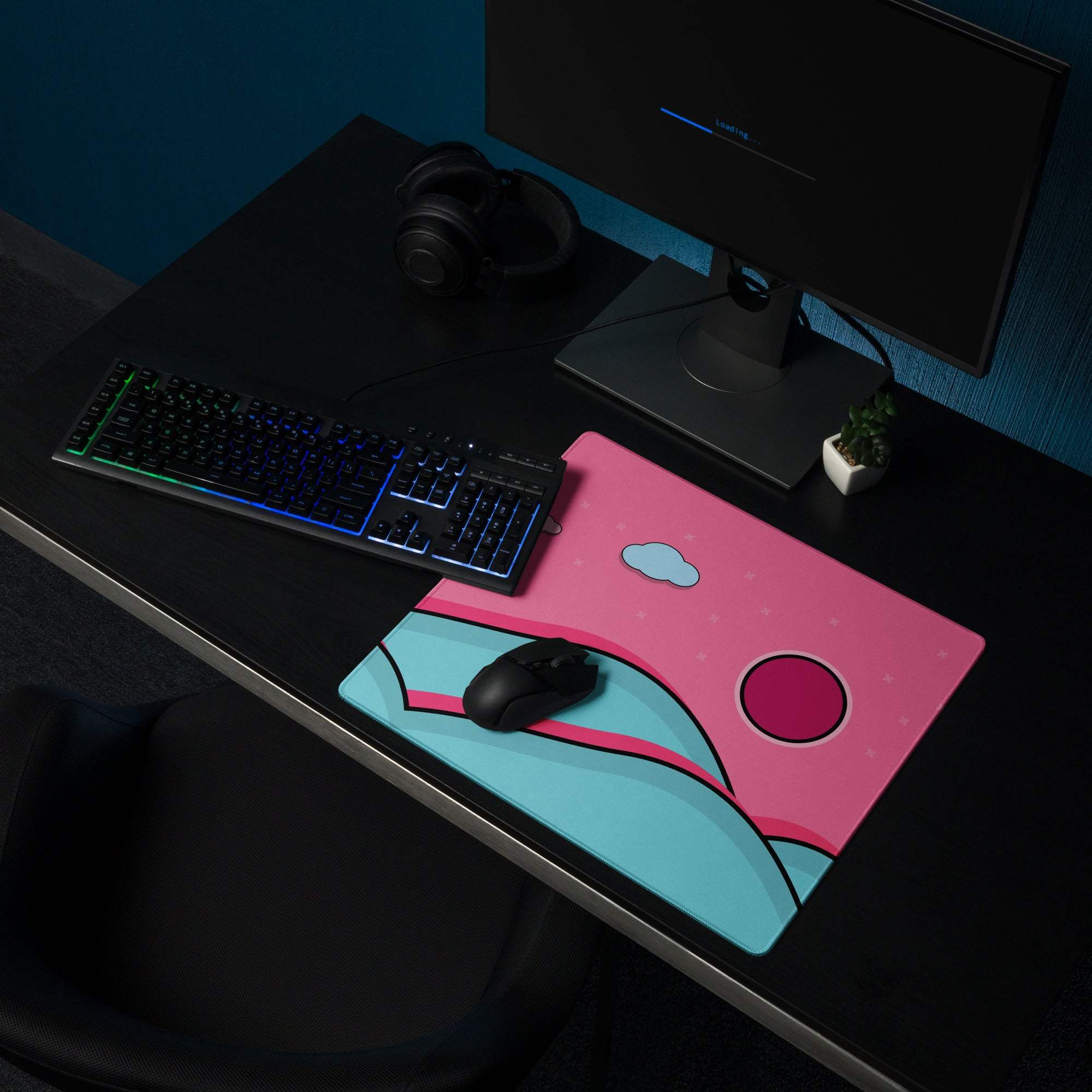 Pink and teal cartoon mousepad with cloud design and non-slip backing