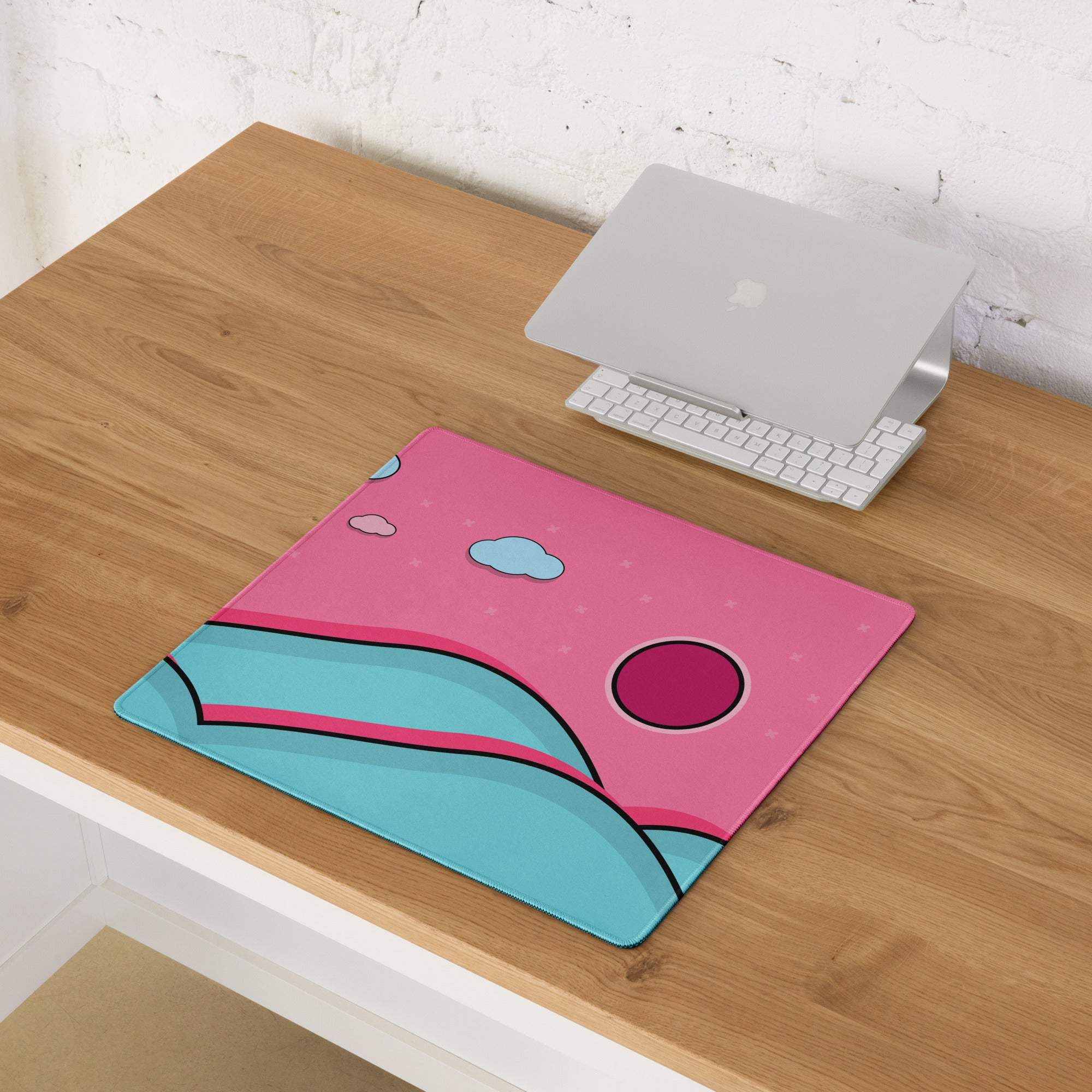 Pink and teal cartoon landscape gaming mouse pad with magenta sun, non-slip backing