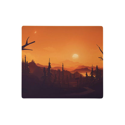 Sunset forest pro mouse pad featuring an orange gradient sky with silhouetted pine trees mountains and a crescent moon