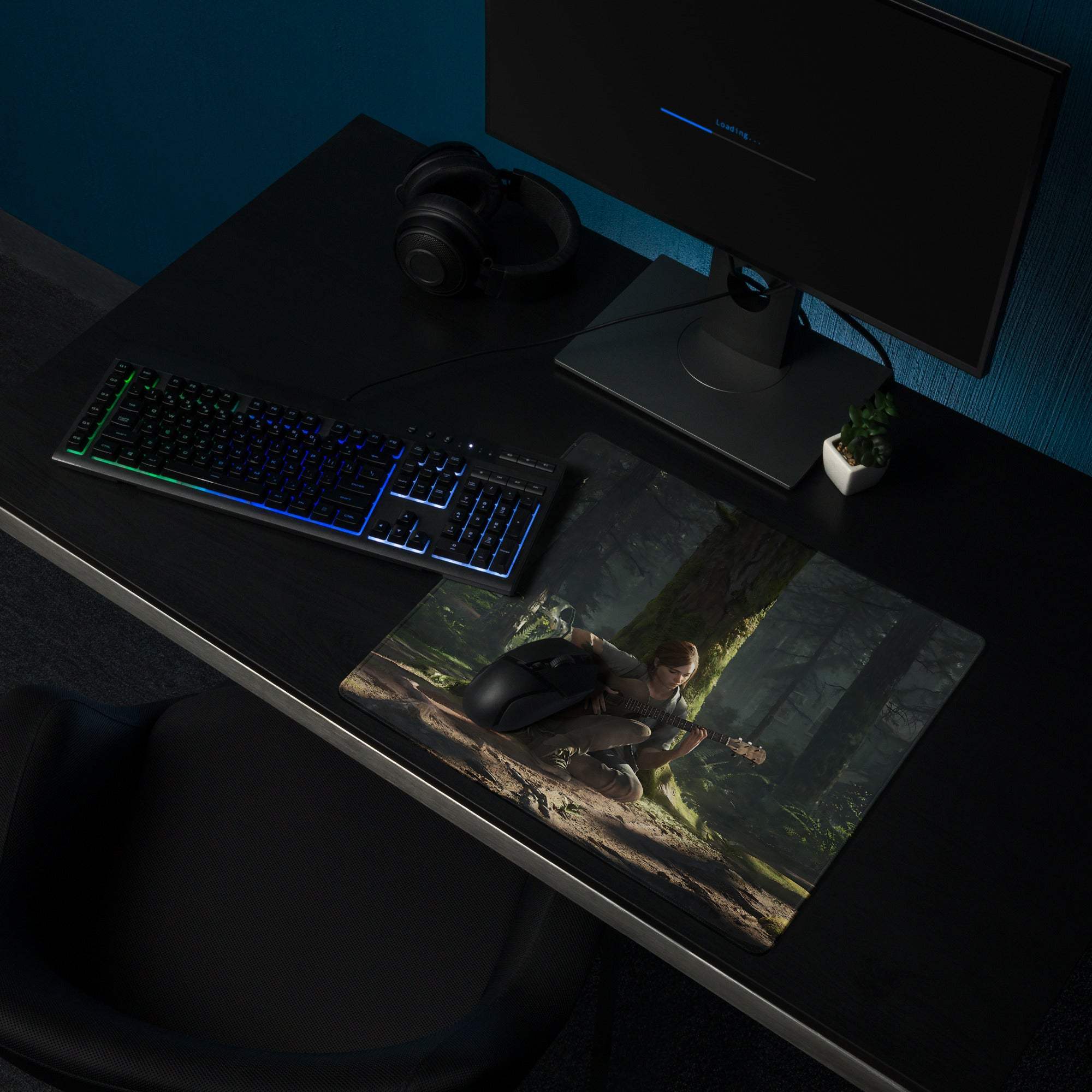 Black gaming mousepad with cinematic forest guitarist in moody green tones