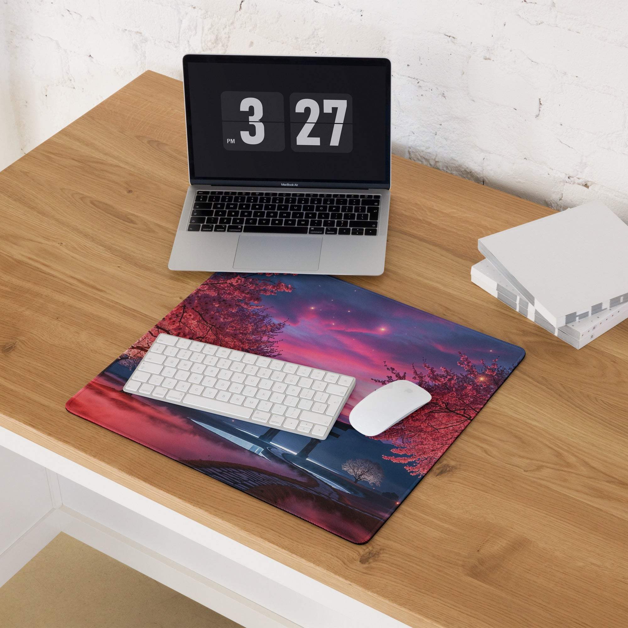 Vibrant sakura twilight gaming mouse pad with cherry blossoms on desk